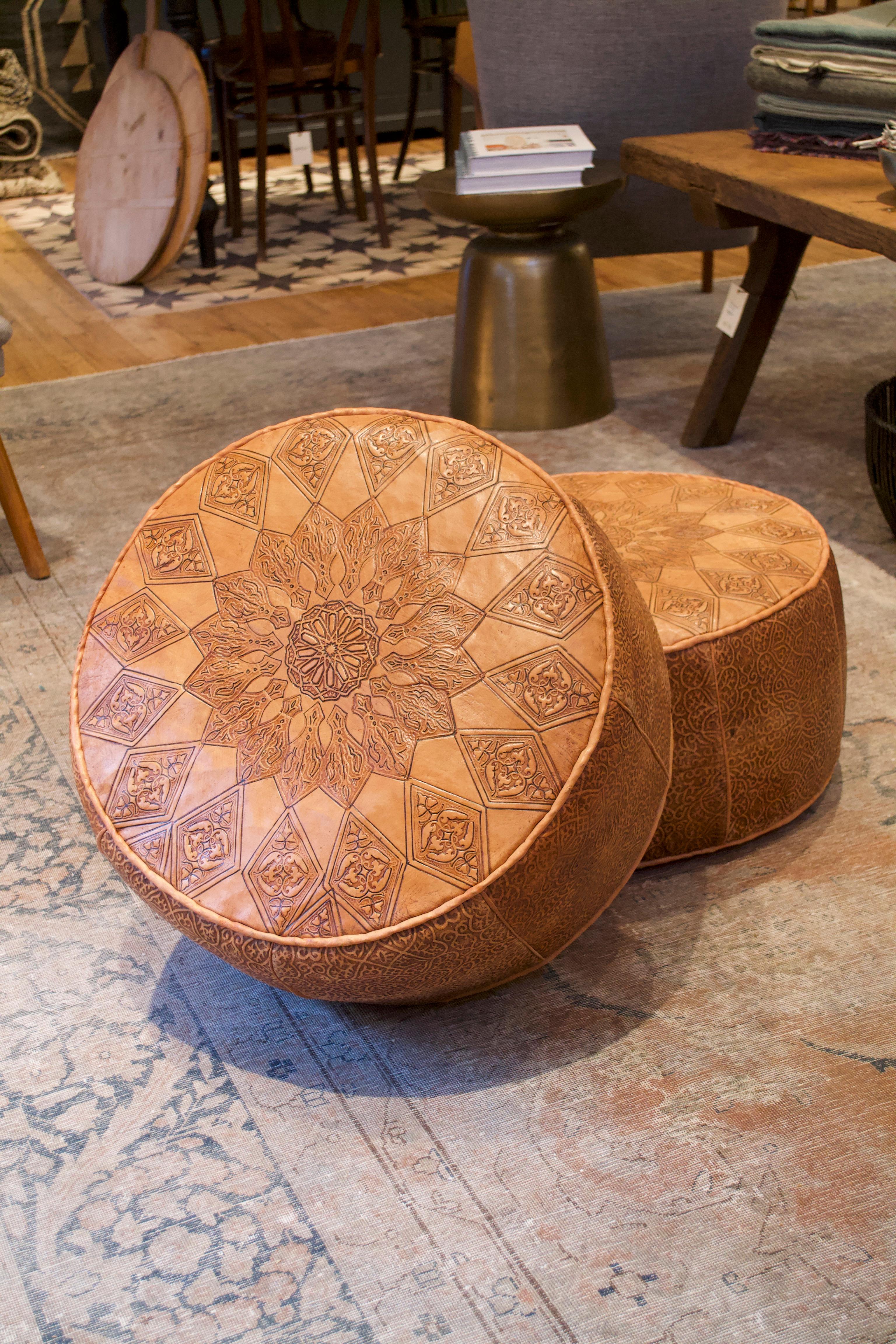 Warm caramel colored leather Moroccan pouf with finely detailed engravings. Leather will age gracefully over time.