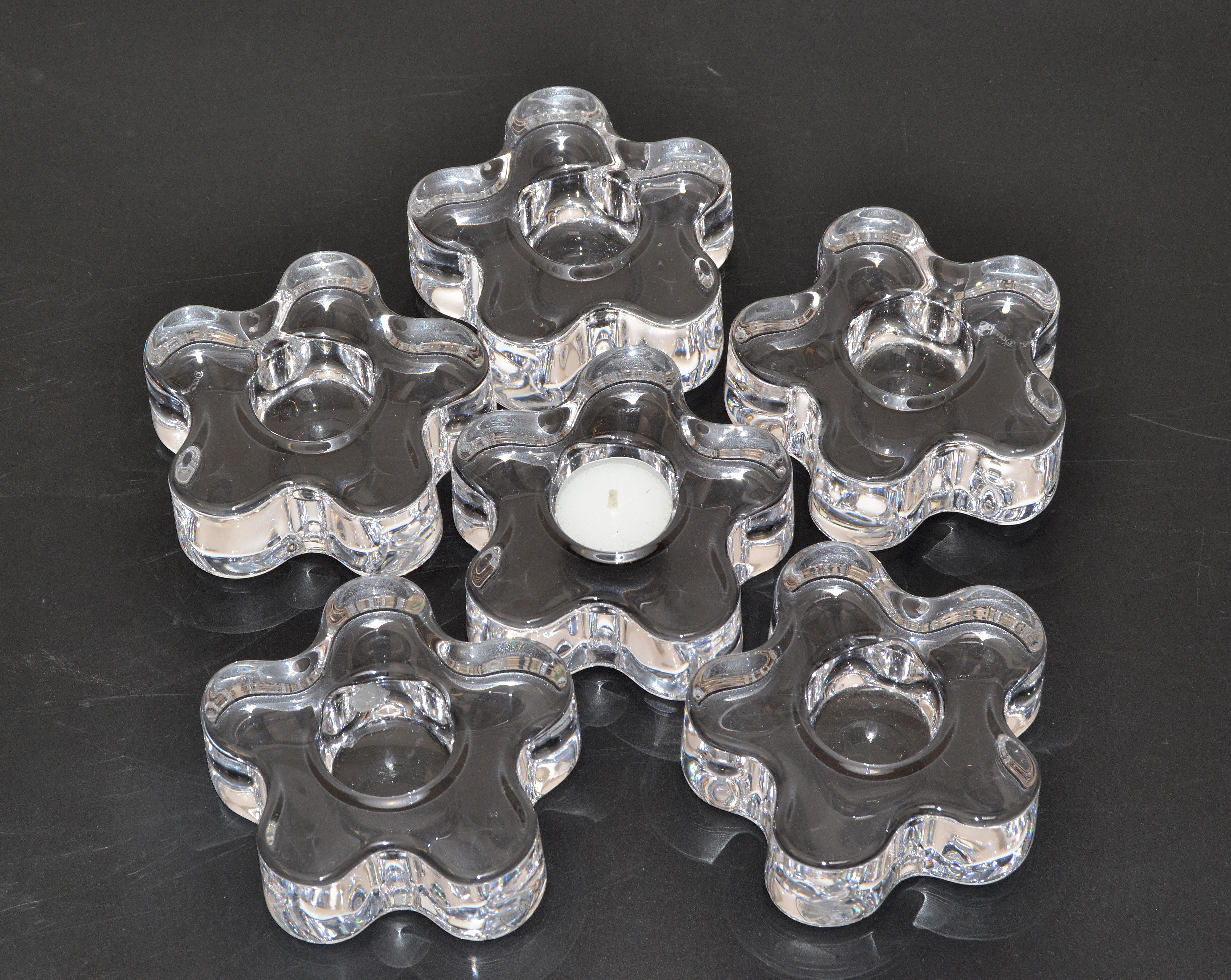 Set of six clear molded crystal flower candle holders designed by Erika Lagerbielke and made by Orrefors Sweden.
Engraved at the base, Orrefors.
Each flower is heavy and pretty to arrange on your holiday table setting.
Simple, Minimalistic and