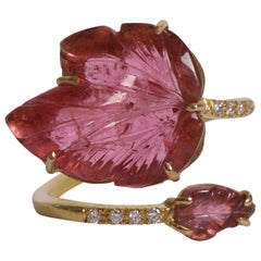 18K Yellow Gold Ring Set With Two Engraved Pink Tourmalines and Diamonds.
