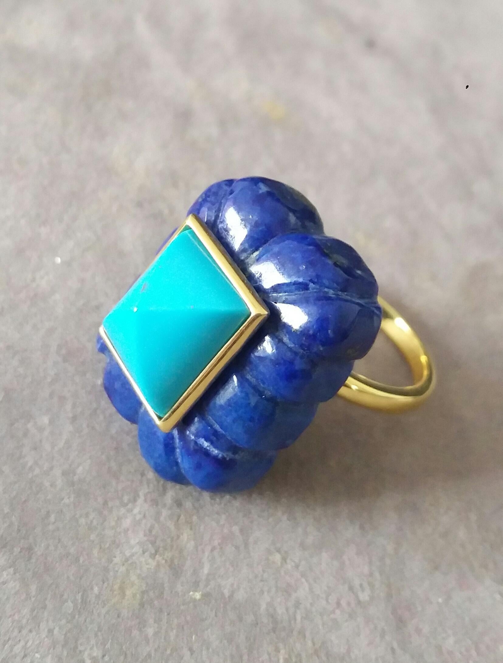 Unique ring with a big Engraved Rectangular Shape Lapis Lazuli ,measuring 20 mm. x 25 mm x 10mm. and weighing 60 Carats with a nice Turquoise Pyramid measuring 10 mm x 12 mm set in 14 kt yellow gold bezel..Ring shank is also in 14 kt  solid yellow