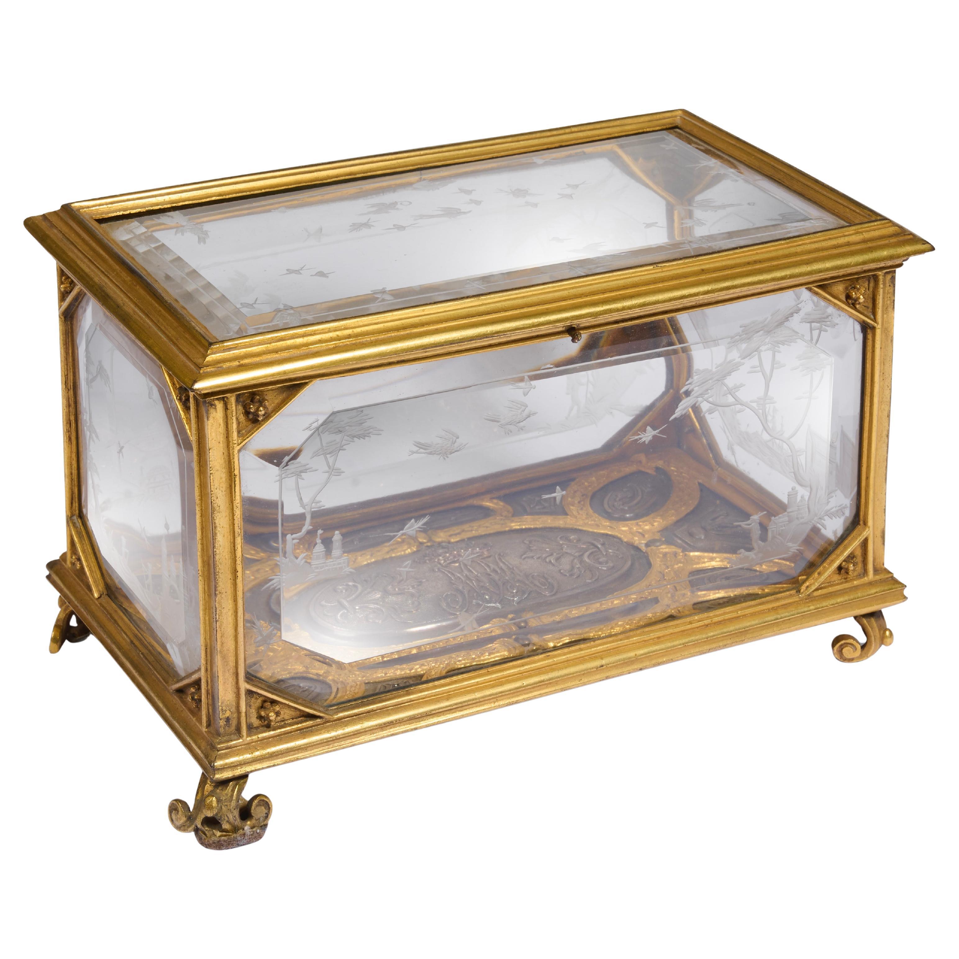 Engraved Rock Crystal and Gilt Bronze Casket with Silver Relief Base.