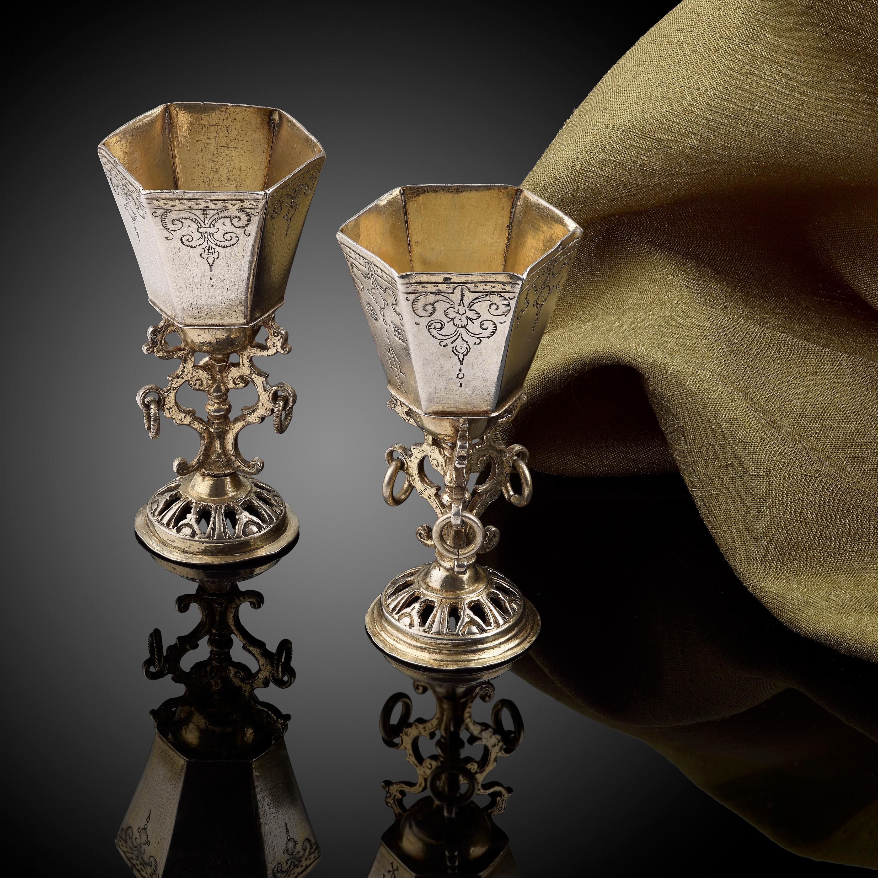 A very rare pair of engraved silver and parcel-gilt cups; circa 1630; the one marked for Norden, North Germany; maker's mark for Englebert Elders - see p.956 Scheffler, Goldschmiede Niedersachans. 

Height 6.6 cms; weight 3 ozs approximate.
 