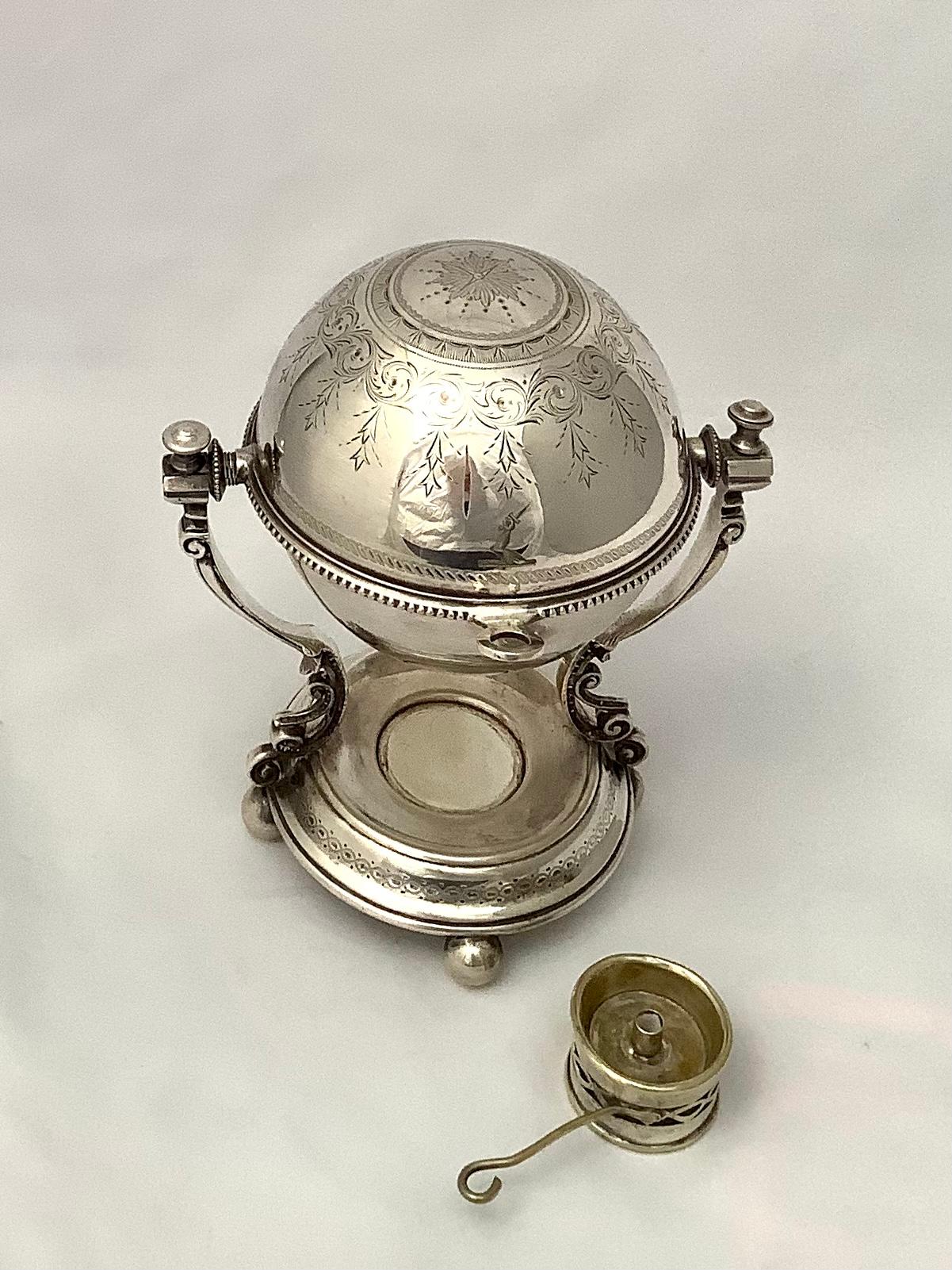 Silver sauce bowl with burner. This beautiful piece is finely engraved throughout. It is perfect to serve a warm sauce in this lidded serving dish with burner. My client used this piece for her powder room soap. It was perfect.