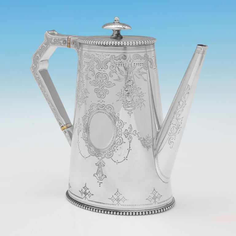 Hallmarked in London in 1875 by Samuel Smily, this very attractive, Victorian, Antique Sterling Silver Coffee Pot, is straight sided, and features brightcut engraved decoration. 

The coffee pot measures 8.5