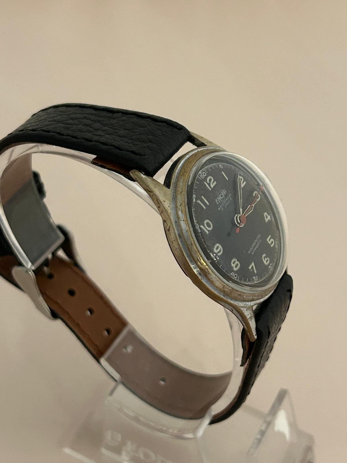Our vintage Enicar features a stainless steel 30.5mm case (33mm inc crown) with black dial signed Swiss, 17 Jewellsm Incbloc, Waterproof, Anti-magnetic, shock protected. A wonderful vintage military style Enicar, this has a new generic leather strap