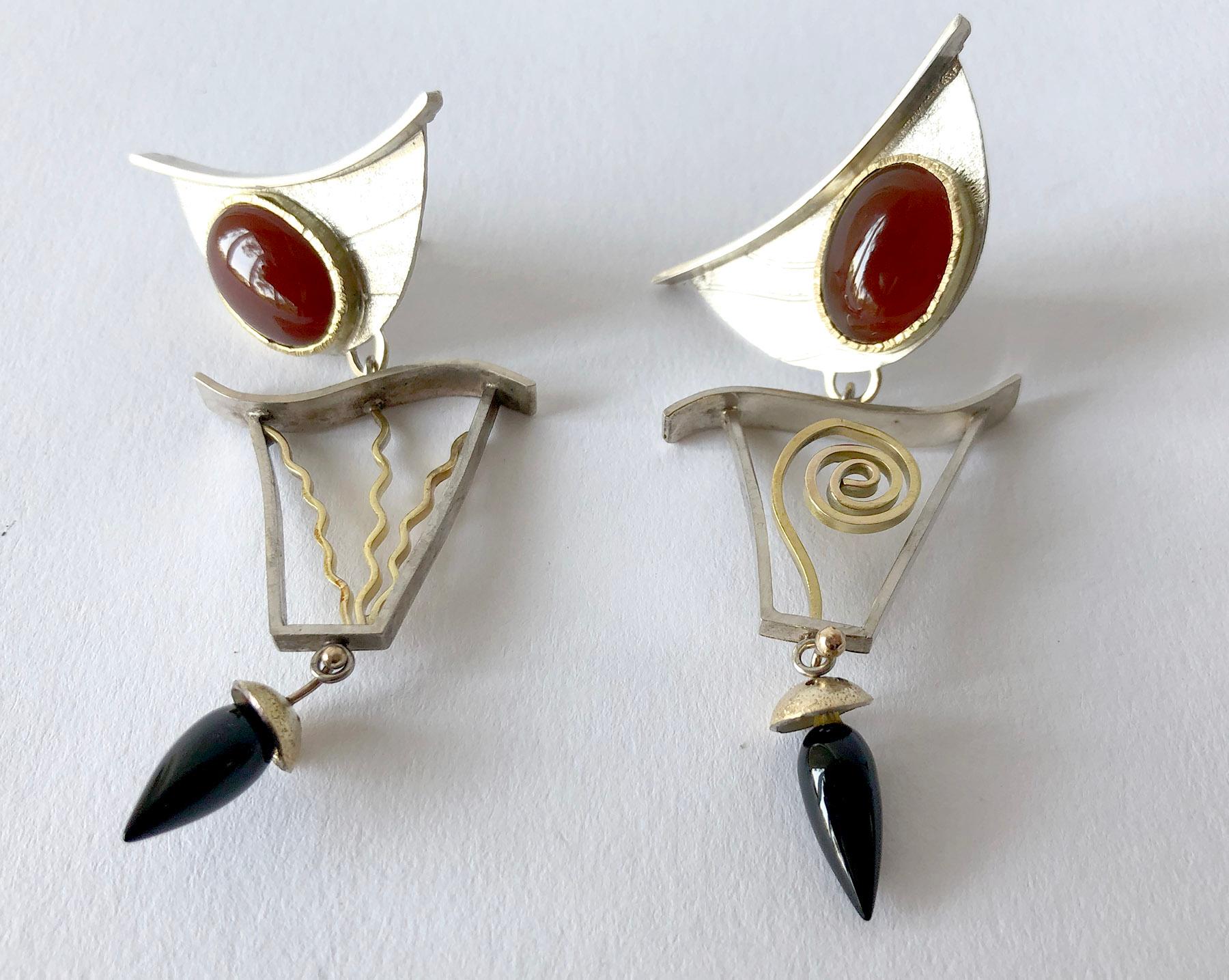 Hand made sterling silver, 14k gold, carnelian and onyx post modernist earrings created by artist and jeweler Enid Kaplan of New York City, New York.  Earrings are entitled 