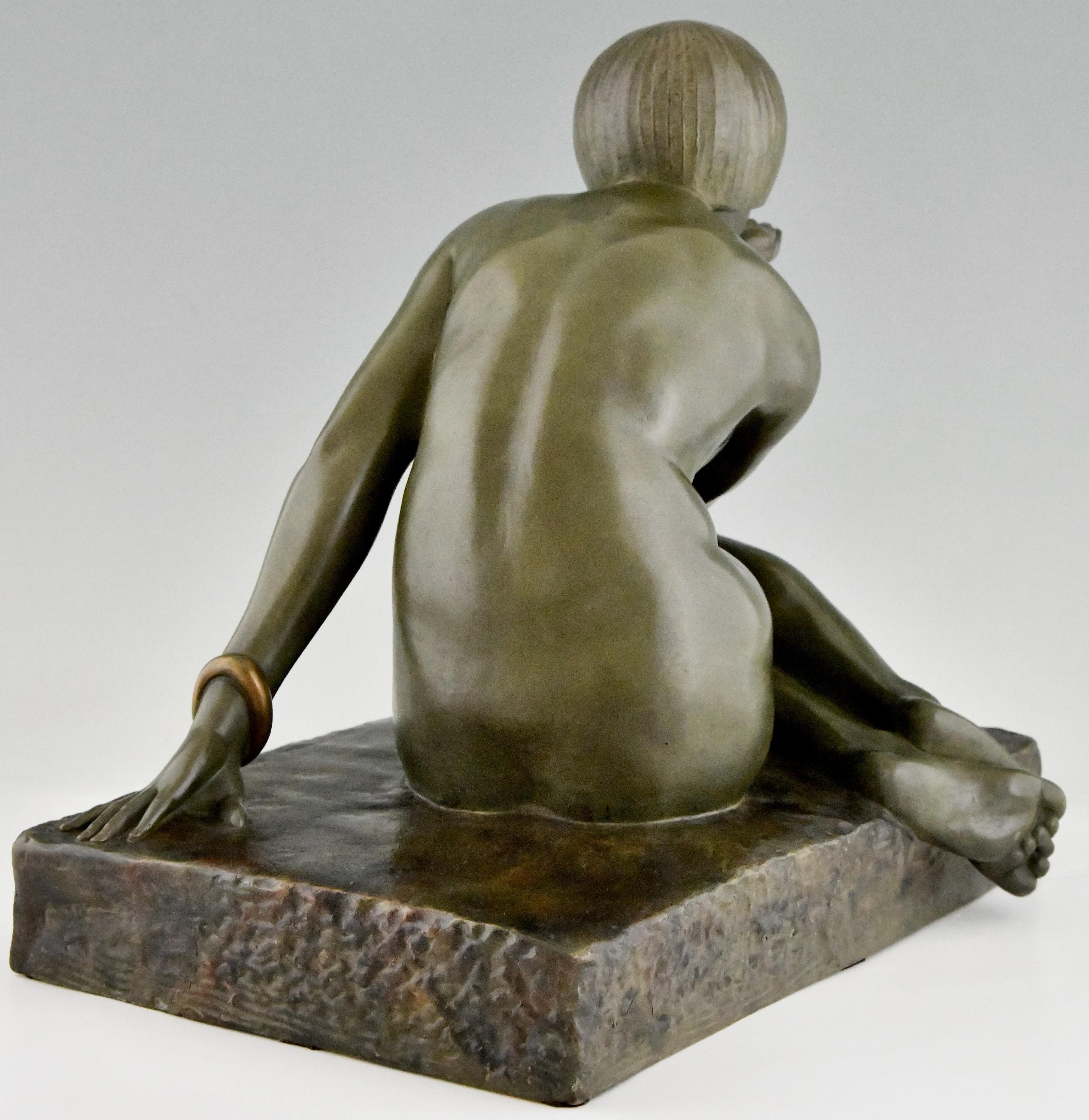 Patinated Enigma Art Deco bronze sculpture seated nude with bracelet by Guiraud Rivière