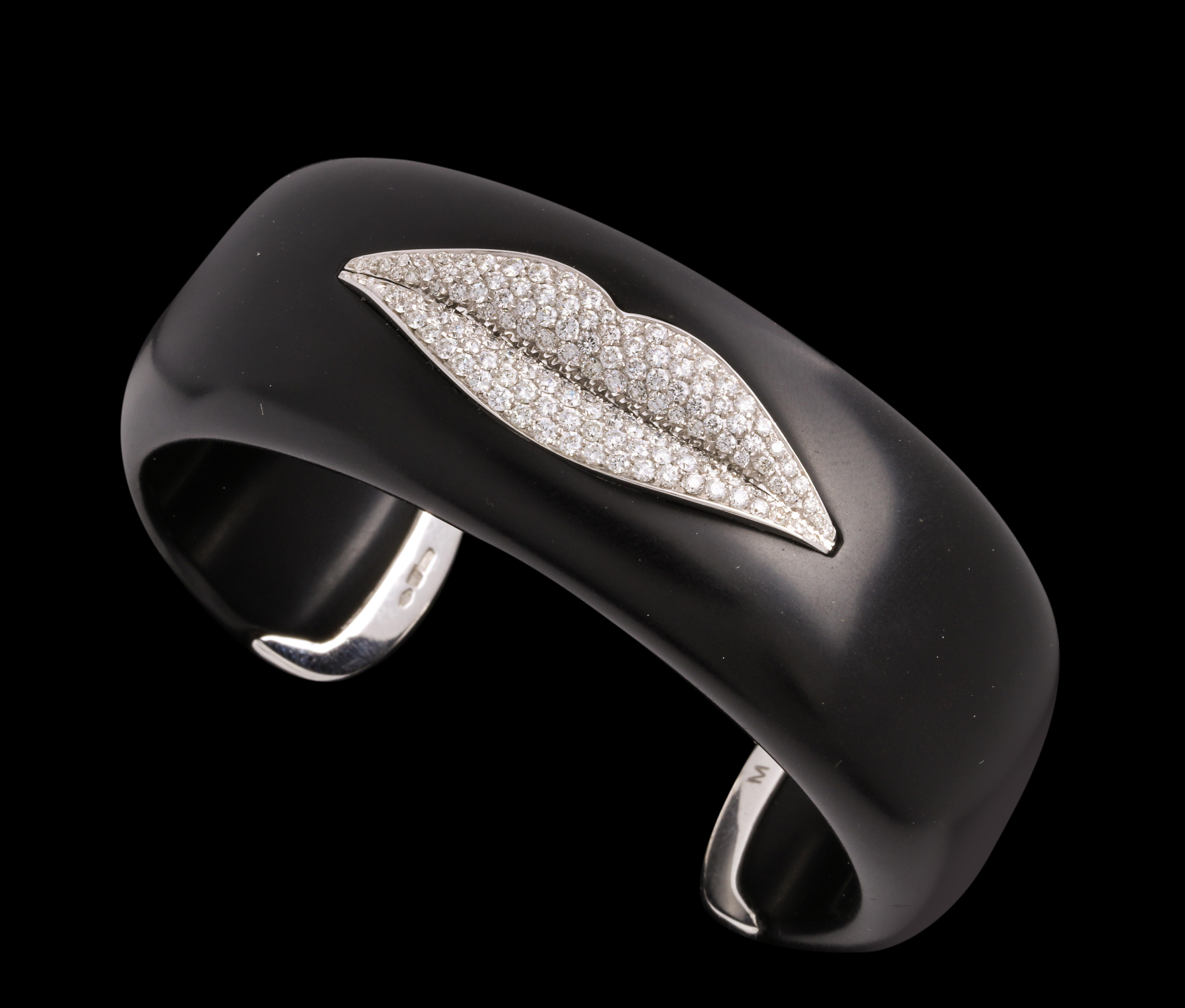 A bangle made by Enigma with her signature lips in diamonds