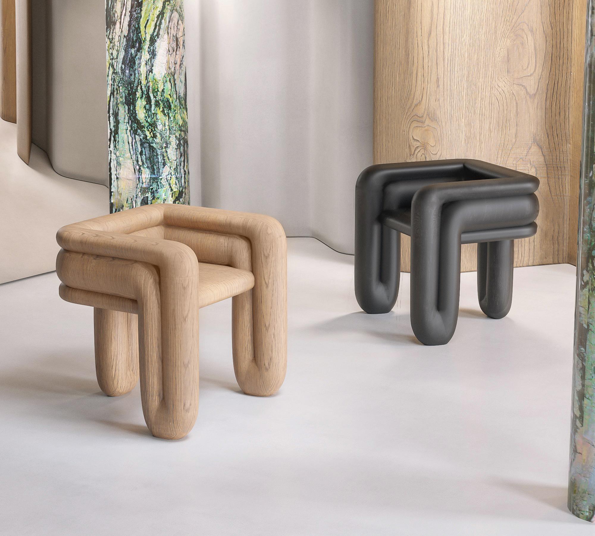 Enigma Wood Accent Chair by Alter Ego Studio
Dimensions: D 66 x W 83 x H 41 cm. 
Materials: Lacquered MDF.
Also available in oak.

Imitation of curved pipes having a single closed contour.
The pipes have different diameters in an asymmetric