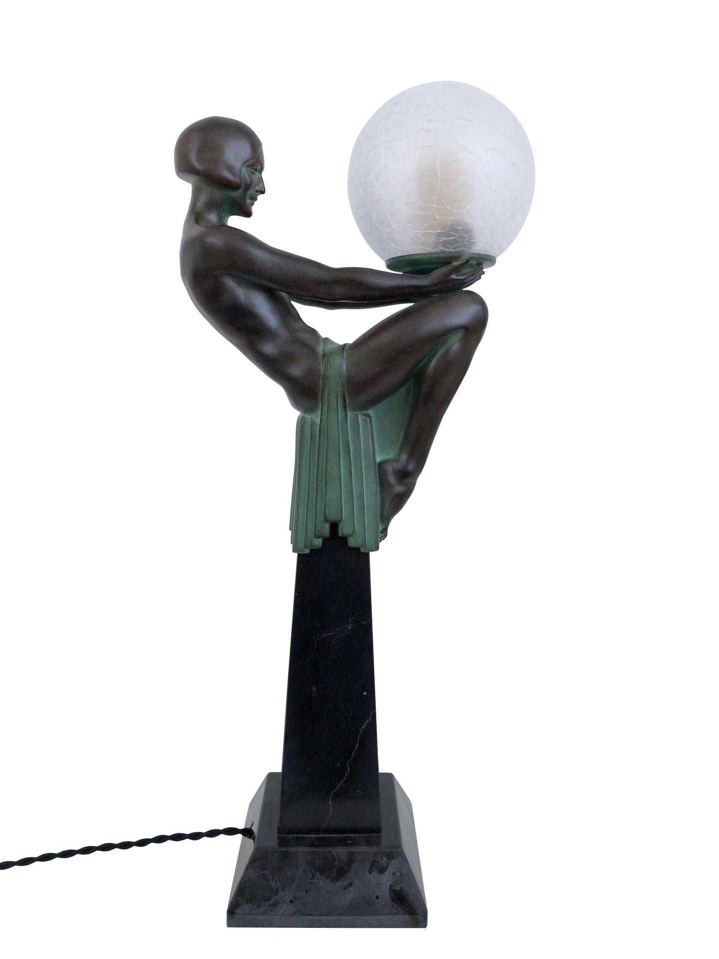 Patinated Enigme Art Deco Style Woman Sculpture on top of an Obelisk Lamp Max Le Verrier For Sale