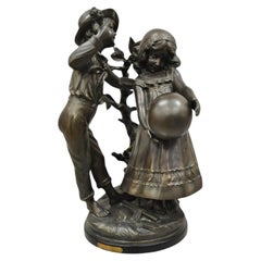 Sculpture de statue garçon et fille en bronze d'après Auguste Moreau