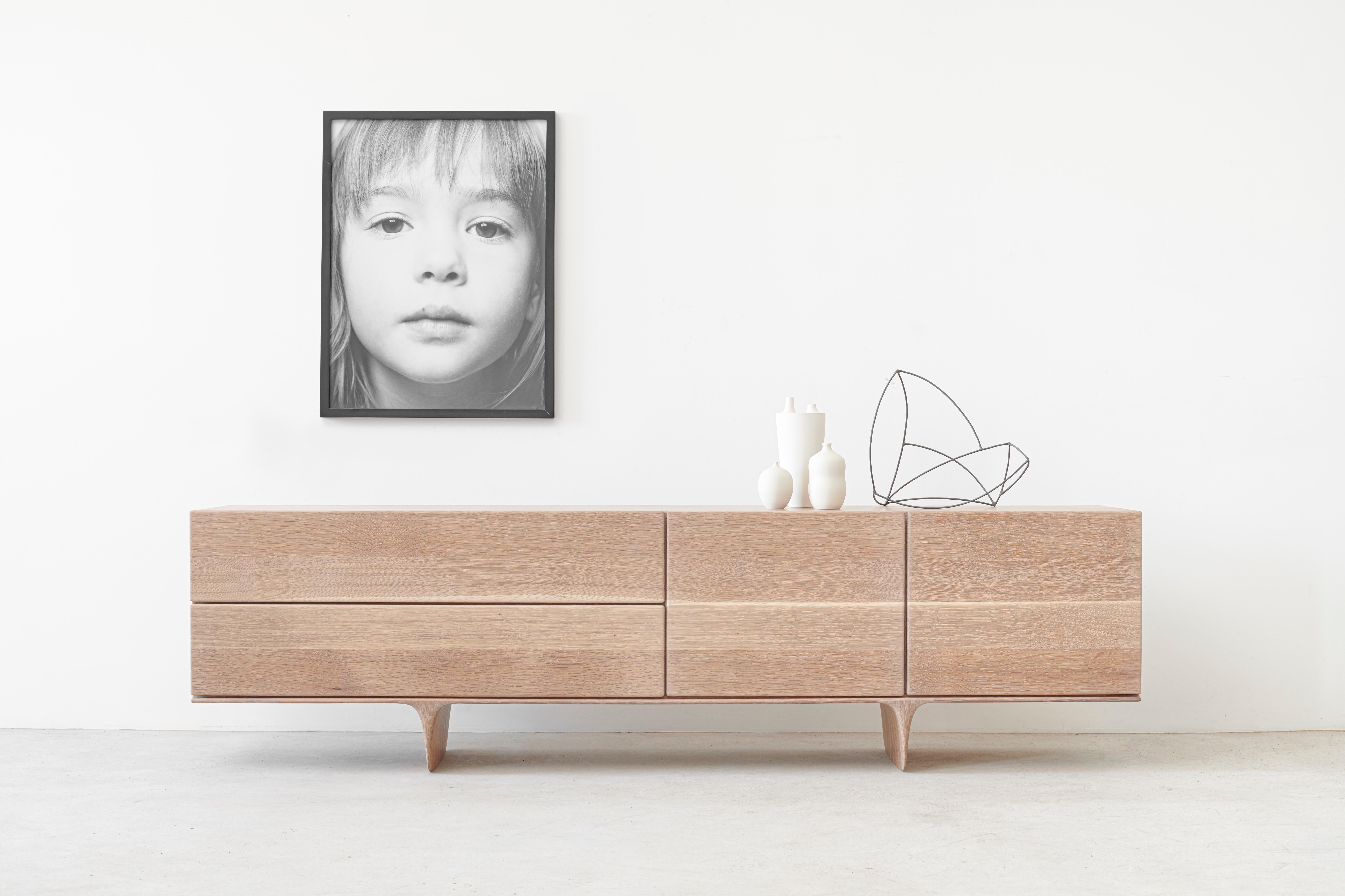 Ennah by Izm design is a versatile design that would be at home in modern, transitional, or traditional settings.
This elegant sideboard features an sculpted base that gives the piece levity and the compound radii continue into all elements of the