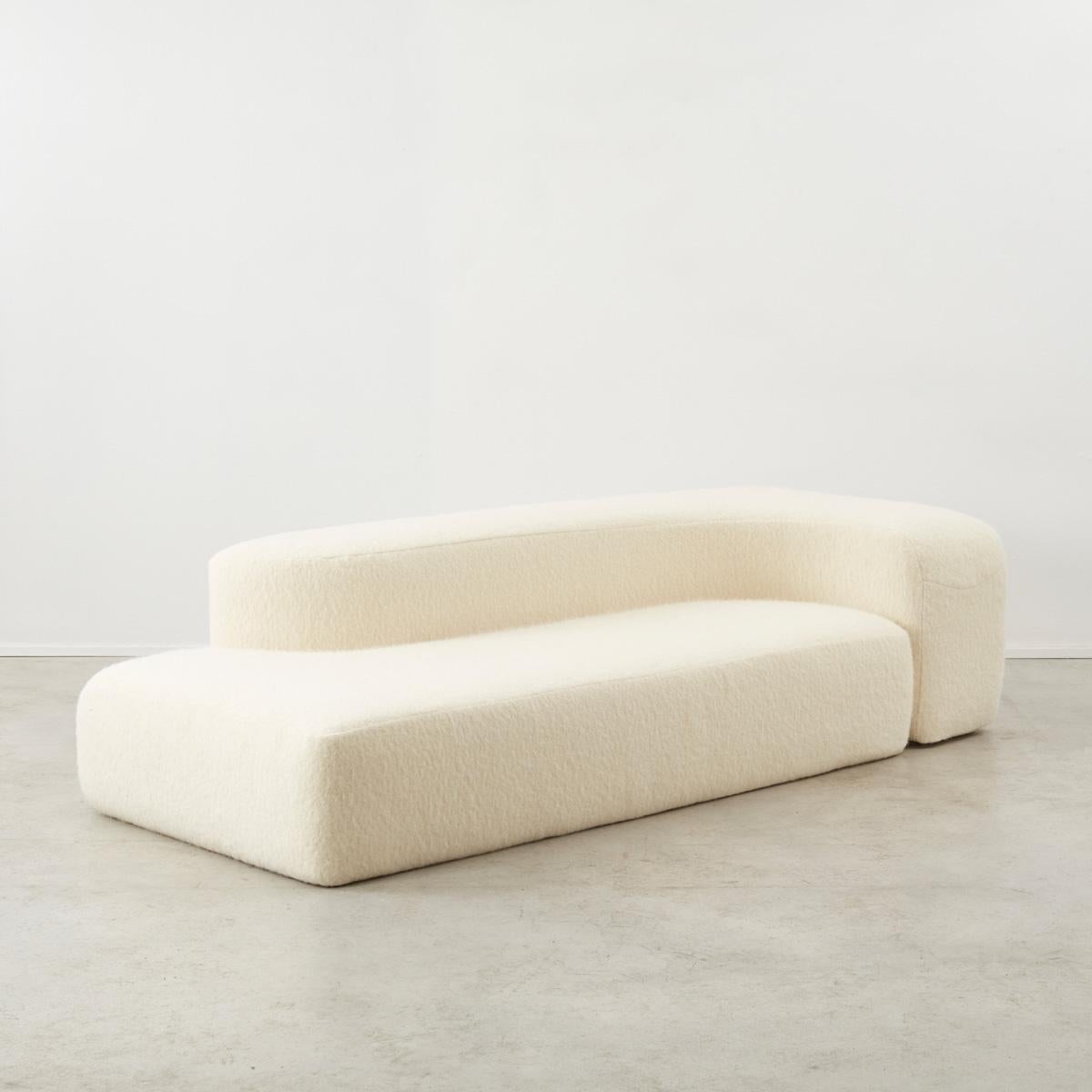 This two-part modular sofa was designed by Ennio Chiggio (1938-2020) for Nikol Internazionale in the 1970s. The sofa creates a shell-like environment that cocoons the sitter.

In good condition. Recently reupholstered in a natural yet luxurious