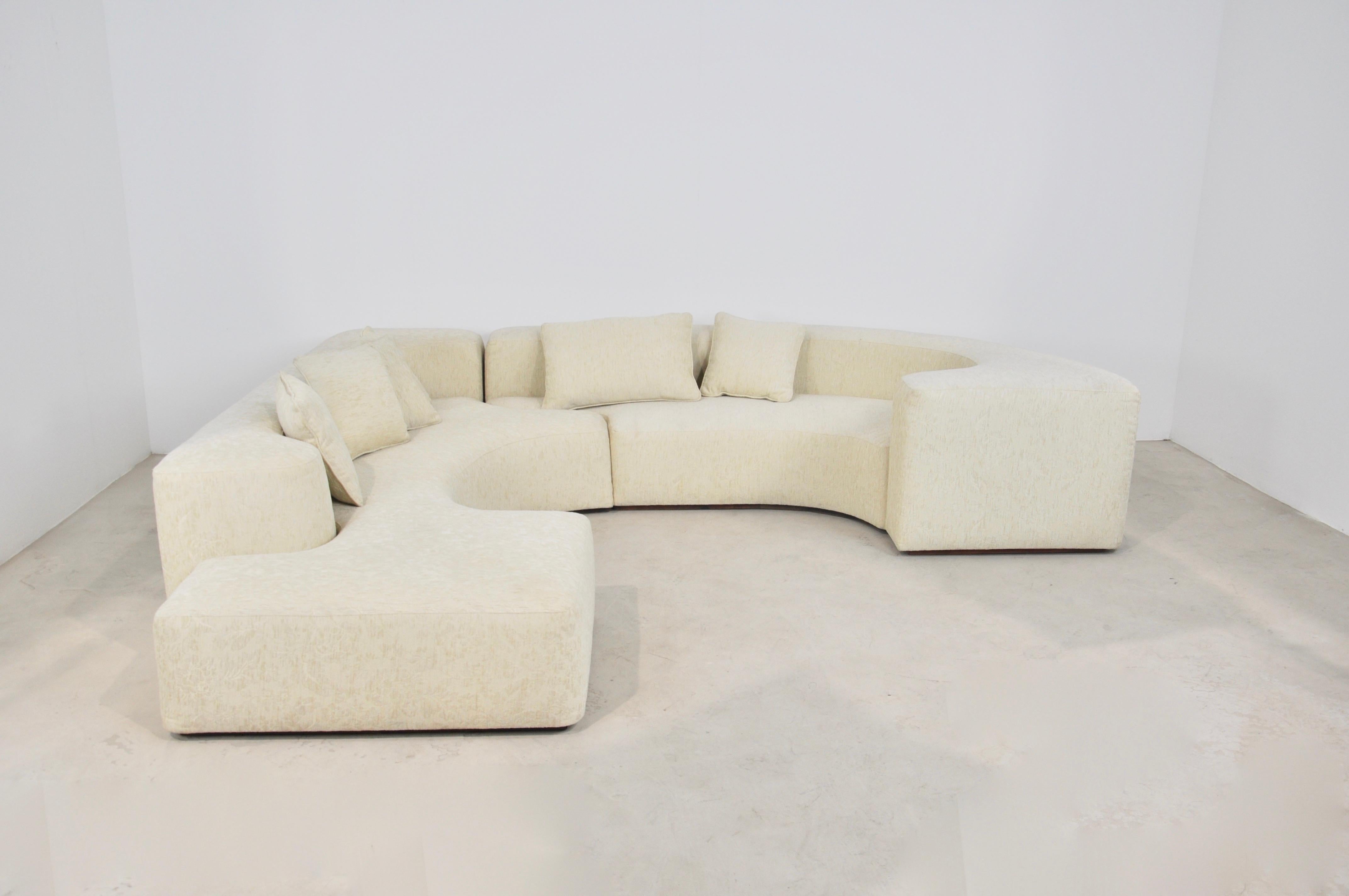 Sofa composed of two fabric elements and 6 cushions. Measures: Seat height 36cm.