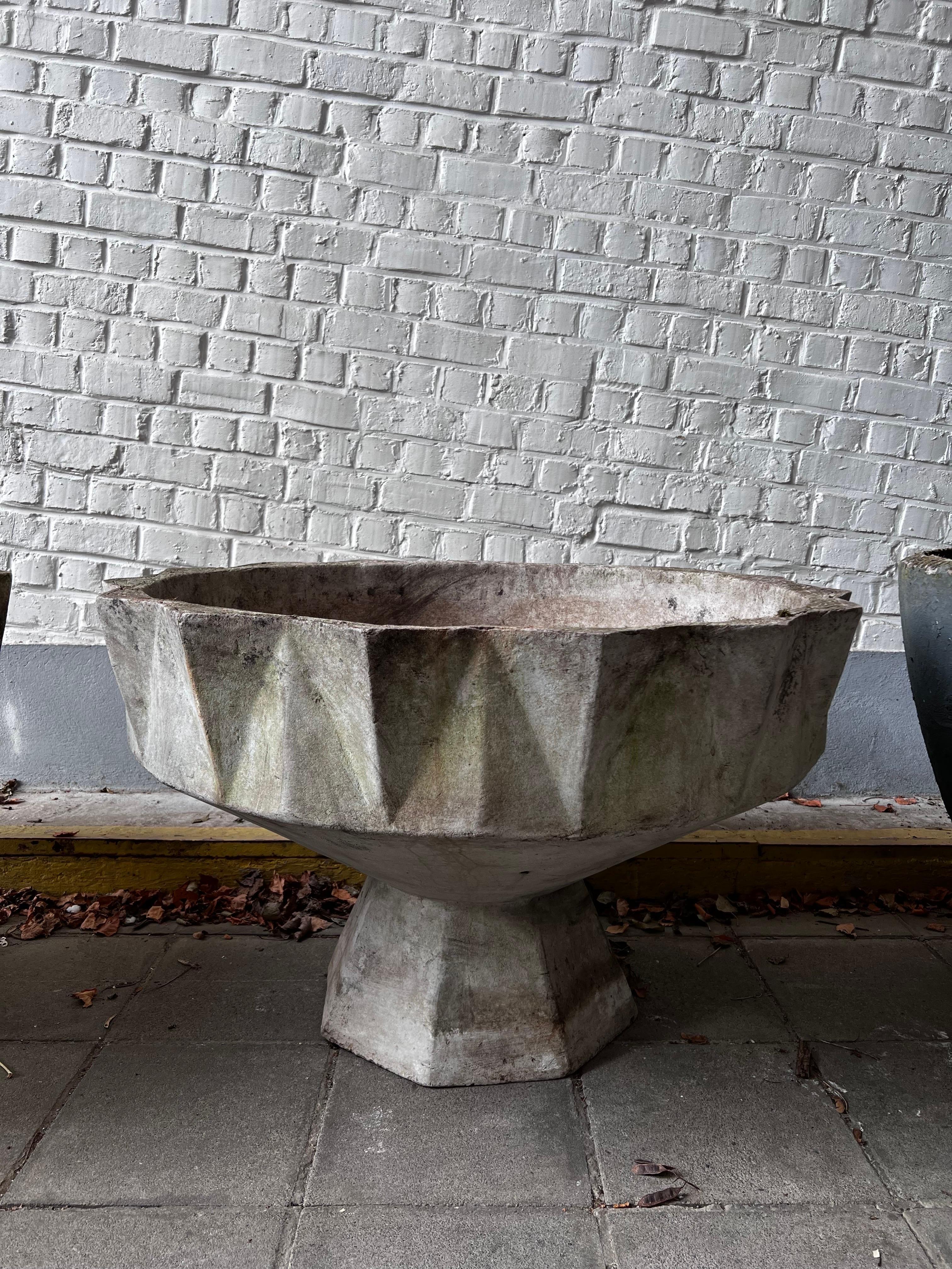 This is a planter like a sculpture! made out of fiber concrete in the 1950's in Switzerland. It is the biggest and strongest from that series. We have two of that model and measurements. We have more models in smaller