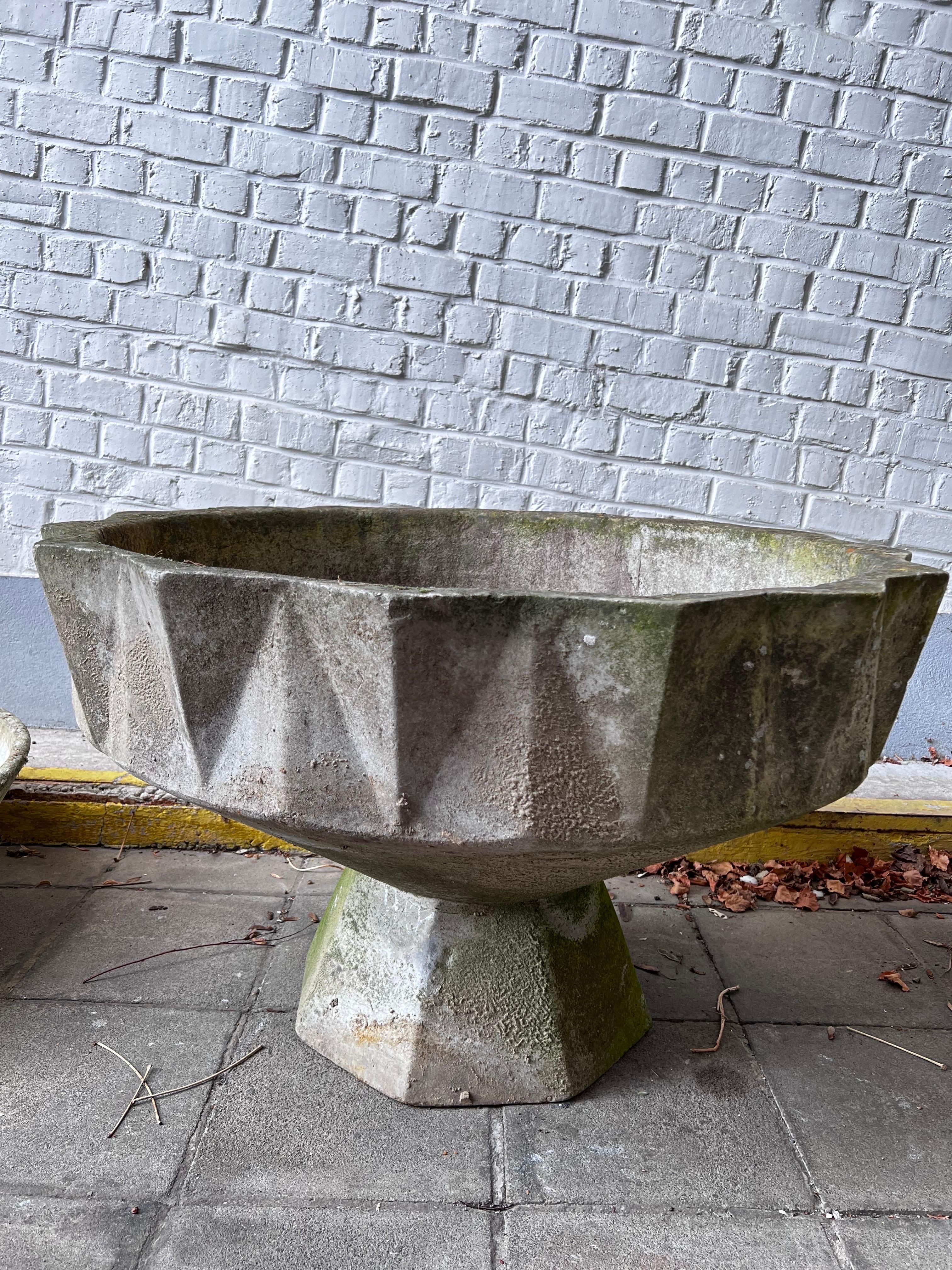 This is a planter like a sculpture! made out of fiber concrete in the 1950's in Switzerland. It is the biggest and strongest from that series. We have two of that model and measurements. We have more models in smaller