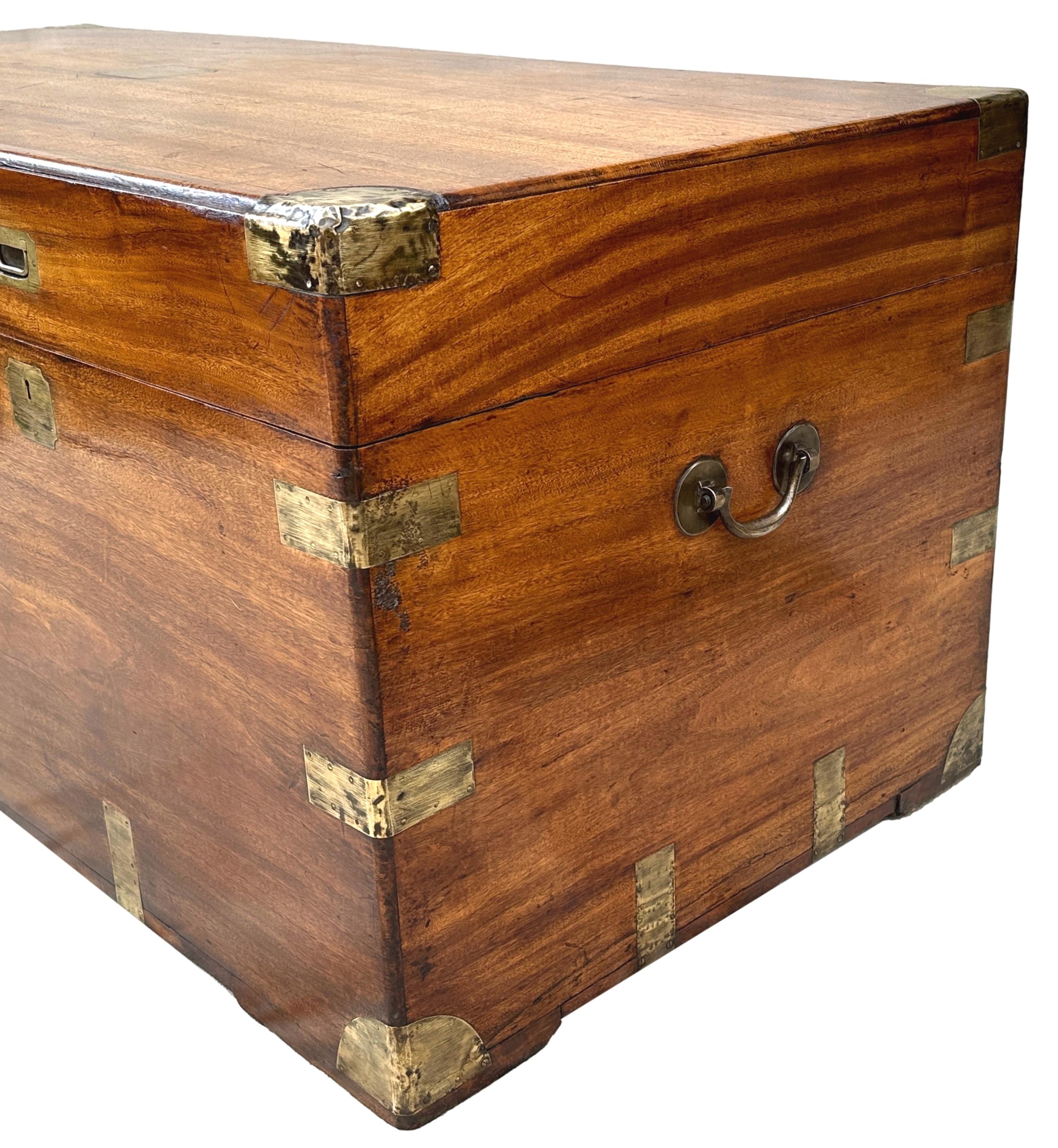 A remarkable mid 19th century Camphor wood Military Campaign trunk, of exceptionally rare monumental proportion, having lift up lid enclosing fabric lined interior, original brass bound decoration, original flush fitted handles and original carrying