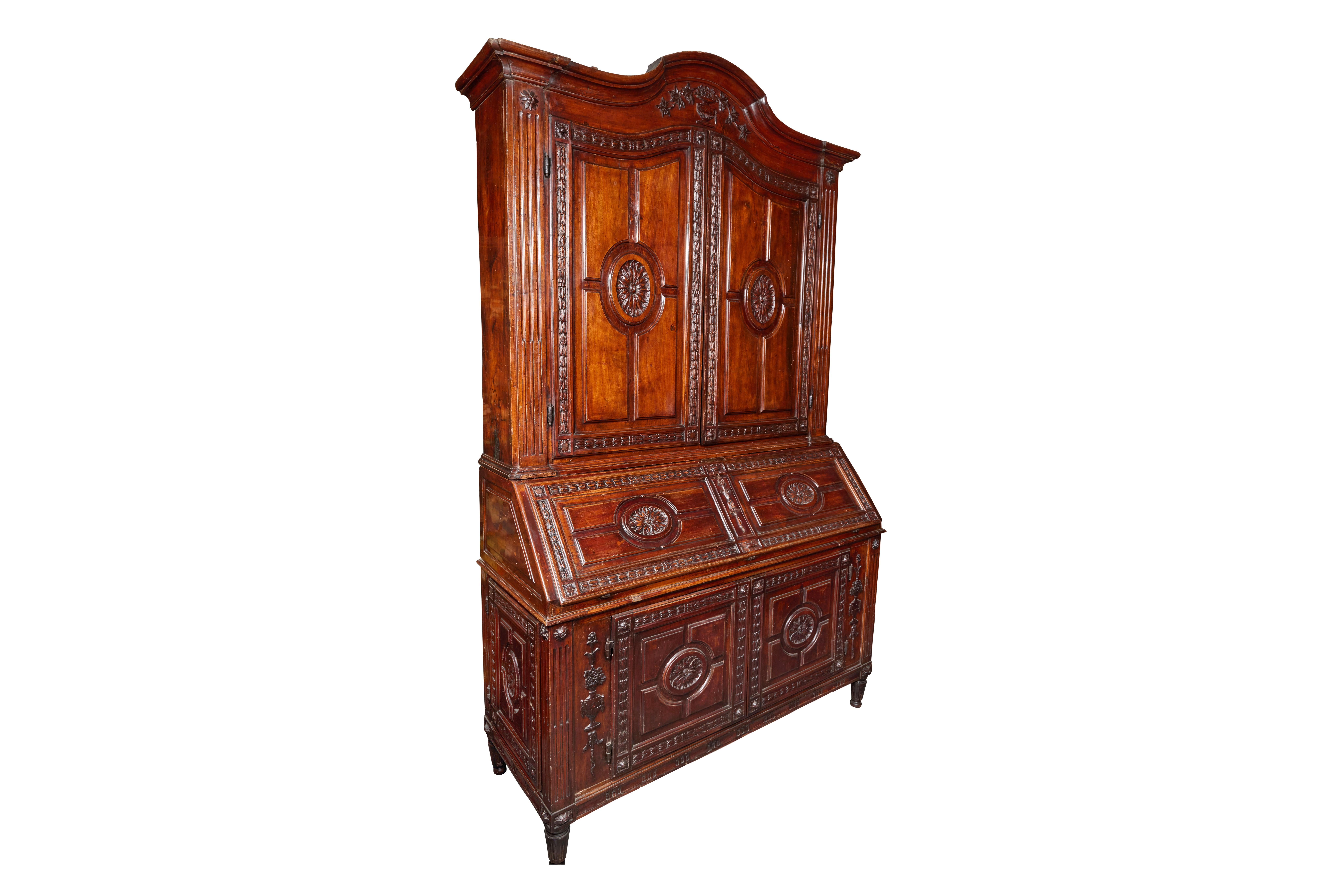 Stunning, c. 1820, solid walnut, two-tier, fall-front scriviana from the Piedmont district of Northern Italy. The paneled doors in the upper cabinet bordered by relief carved acanthus leaves surrounding a center medallion of blossoms. The lower half