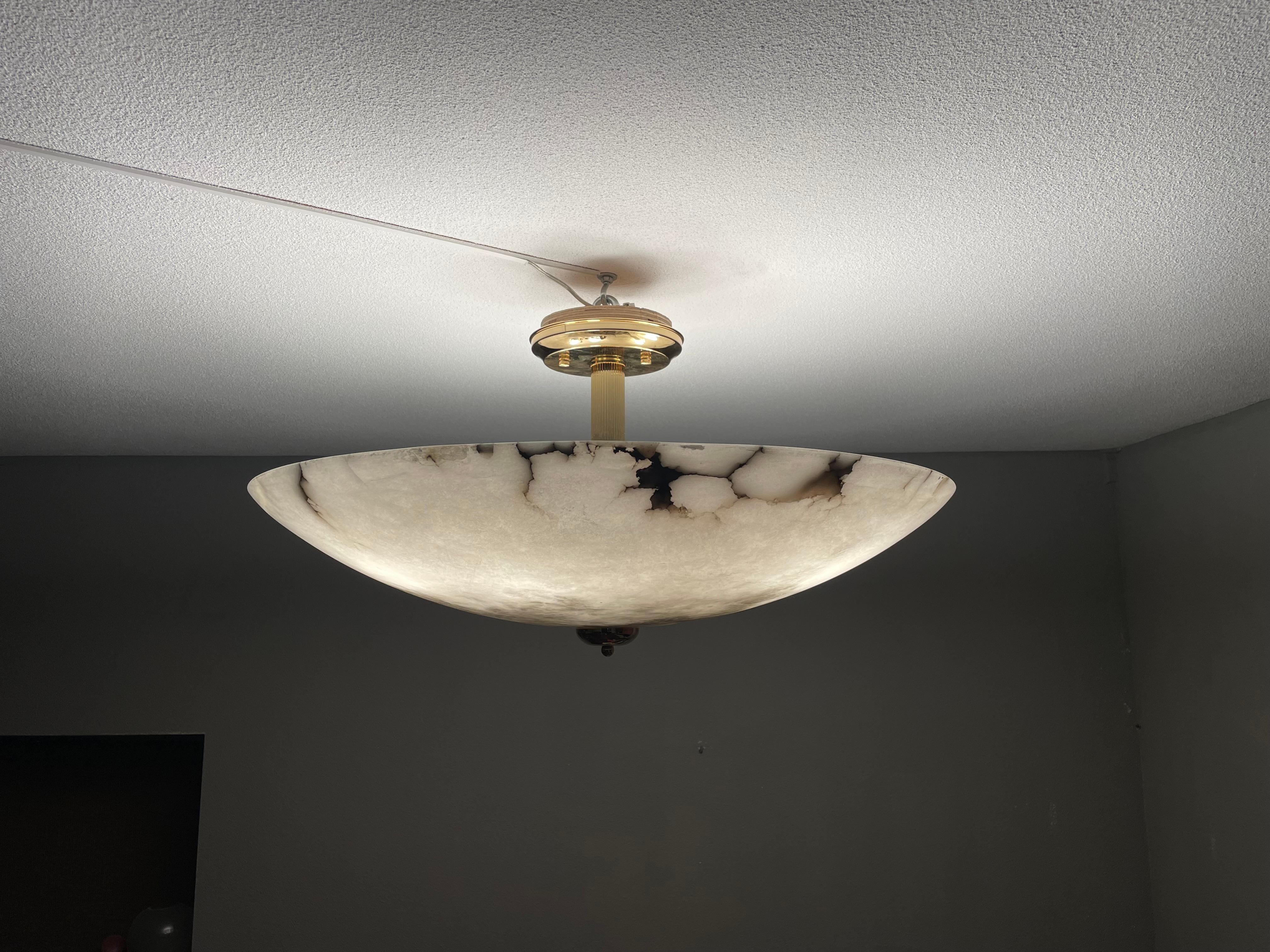 One of the largest, most stylish and truly lunar-like alabaster lights.

This rare and extra large, six-light alabaster flush mount also is of a beautiful, timeless design. Besides its extraordinary size, what makes this alabaster shade stand out