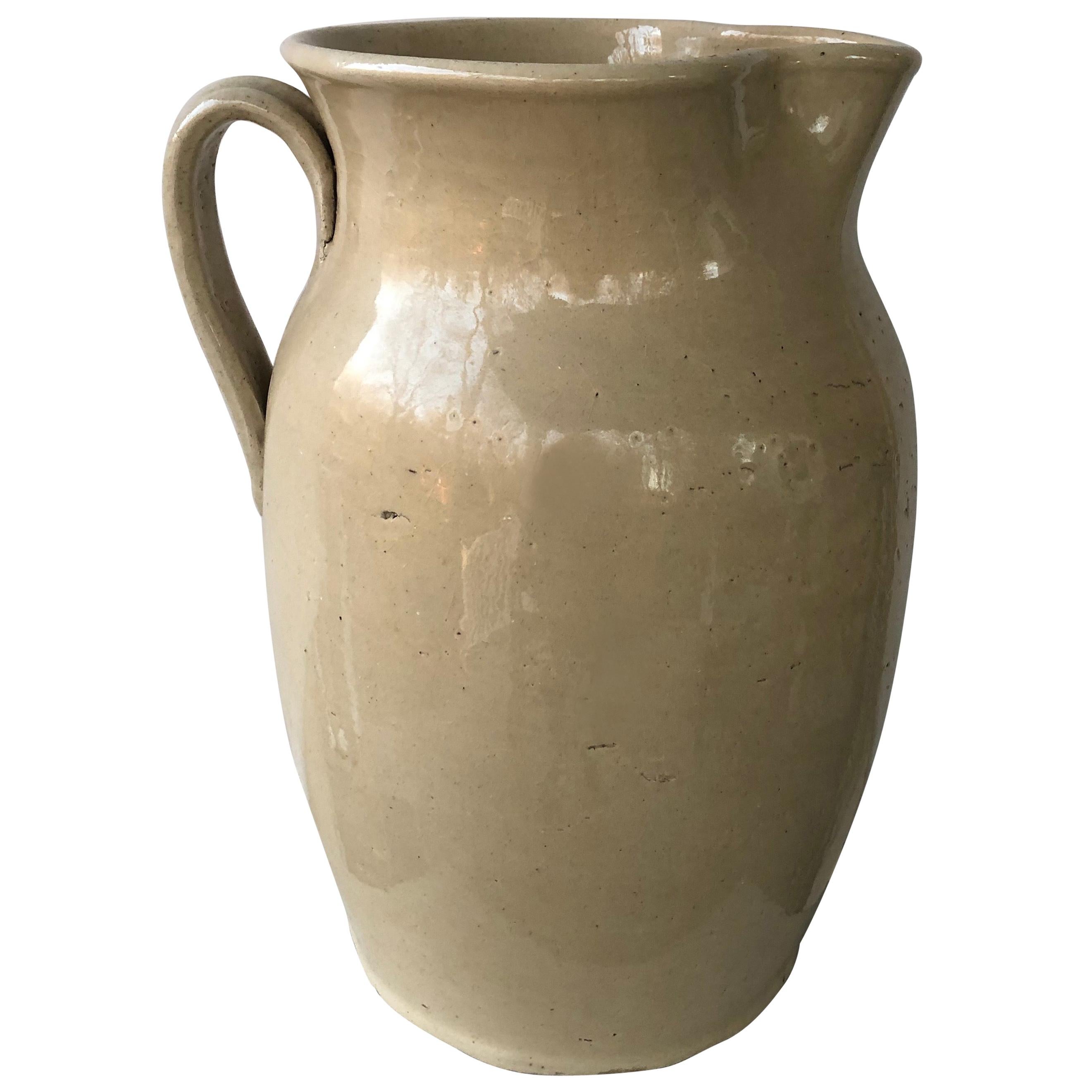 Enormous Cream Glazed English Pottery Pitcher For Sale