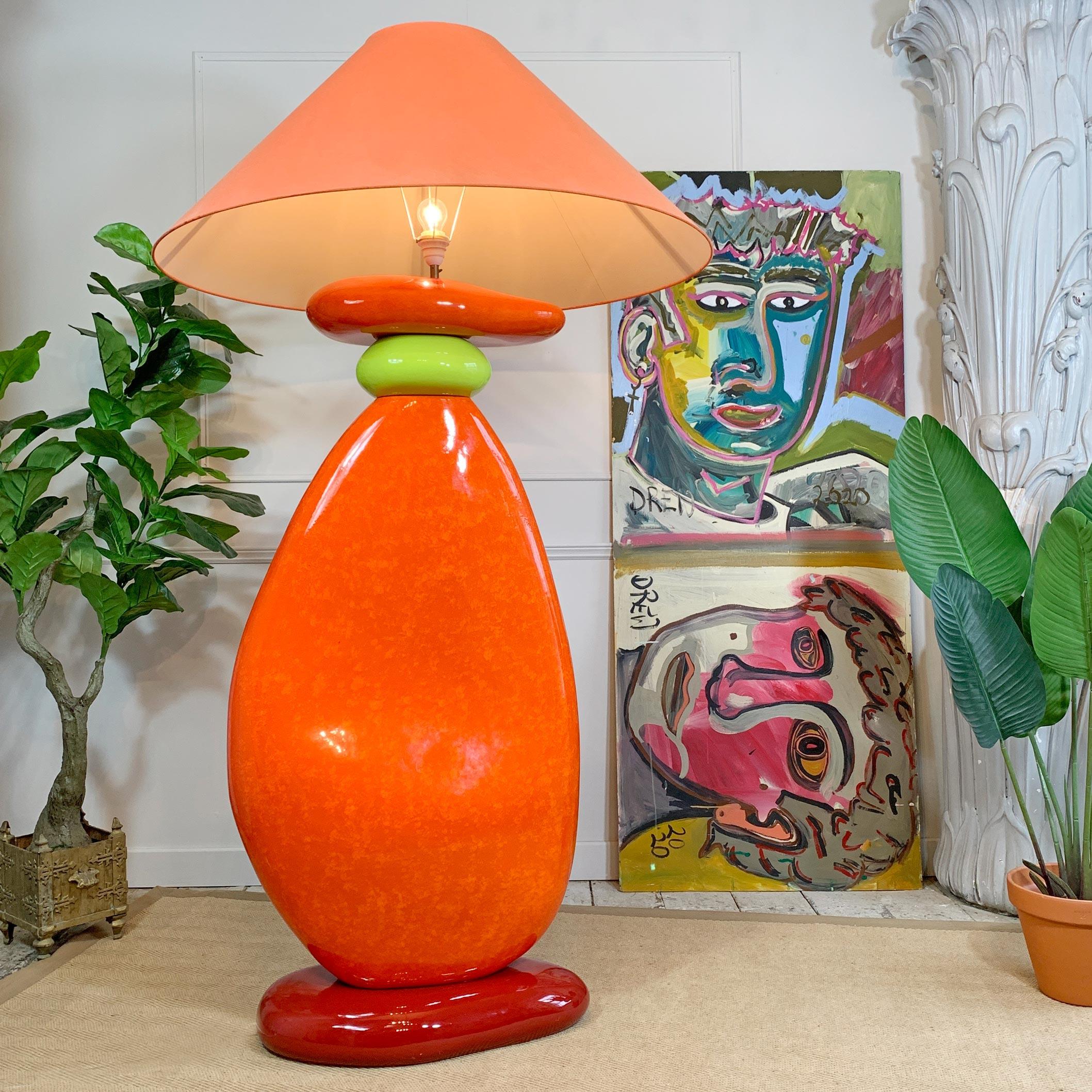 This is a spectacular floor lamp, designed by Francois Châtain, France, in the 1980s. The design replicates huge shaped pebbles balancing on top of each other, in bright primary colours of Orange, Red, and Lime Green. 

The lamp shade alone is 1