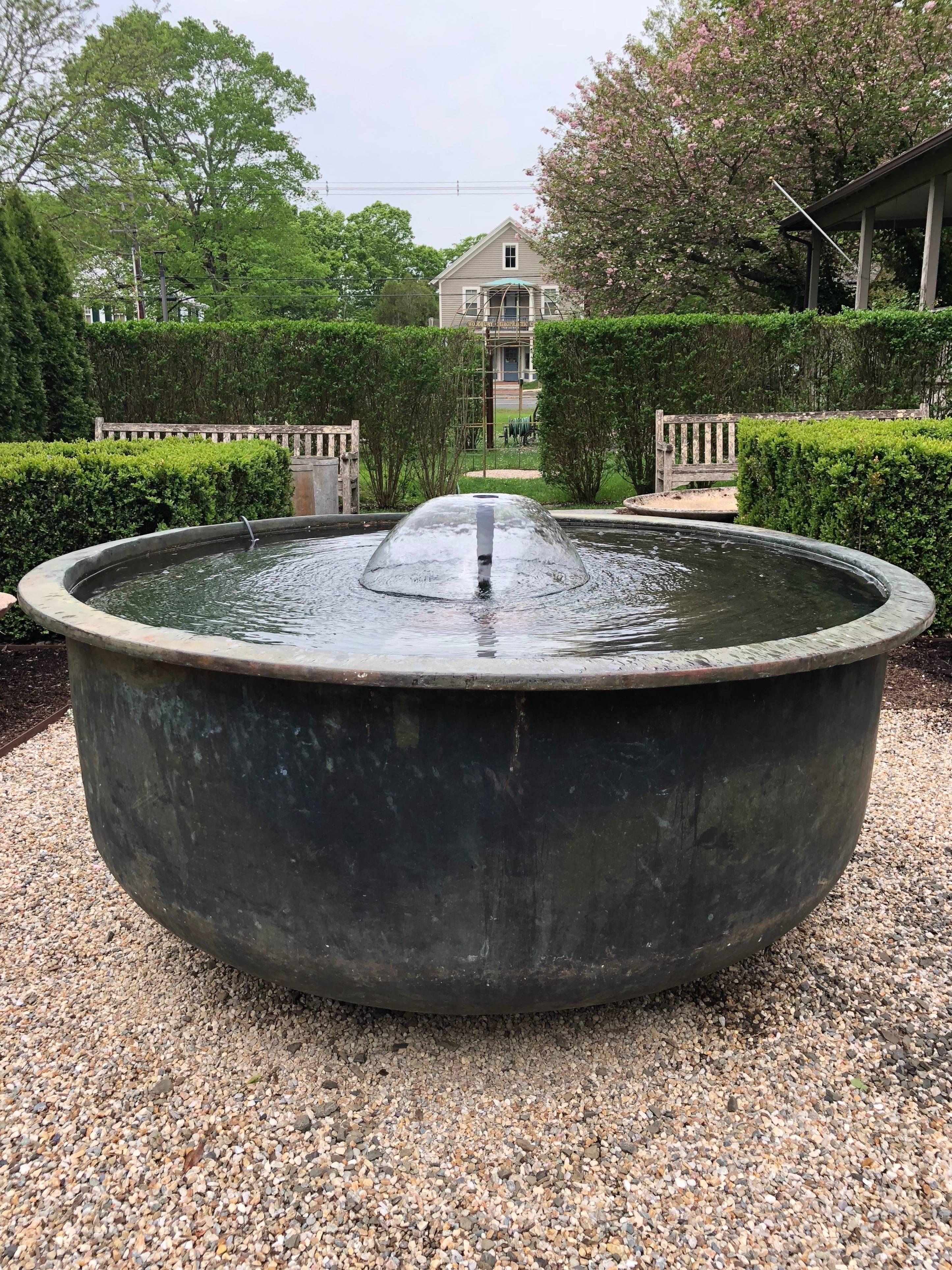 What a find! Made of heavy copper with an iron ring underside the lip, this huge tub was originally used to cook the milk for cheese in the late 19th century. We have had two of these in the past, but this is the largest we've found in an