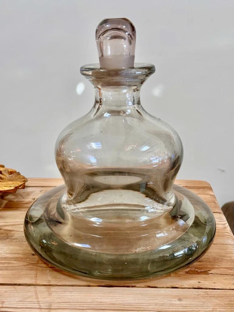 Rare 19th Century French hand-blown glass massive, voluptuous perfume bottle with stopper.  Used in a Parisian department store.  13.5” h.x 11.5” diam.

