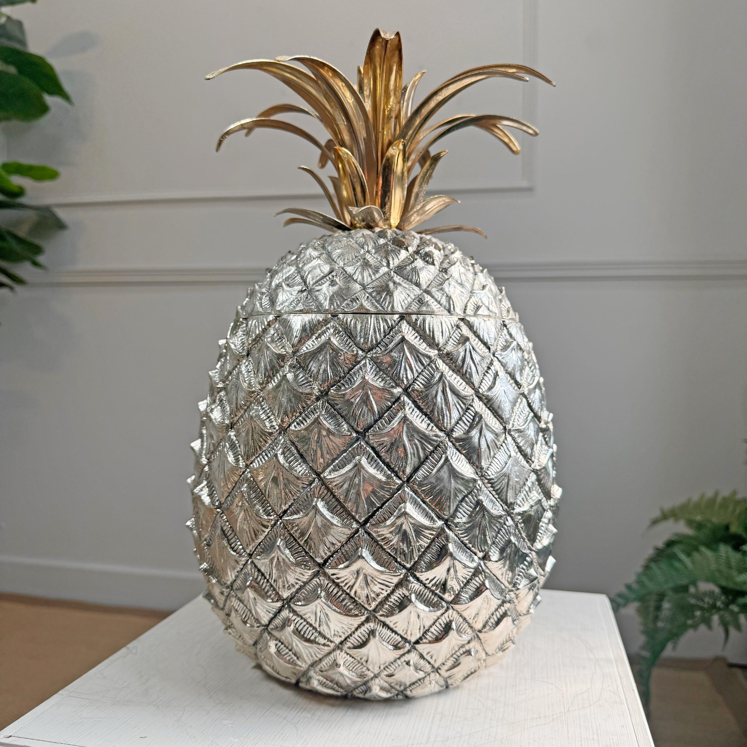 An incredibly rare Mauro Manetti Champagne / Ice Bucket of huge proportions, formed as a silver Pineapple and topped with a gilt frond lid, this exceptional piece has all the original lining and is stamped to the base with the Manetti makers mark.