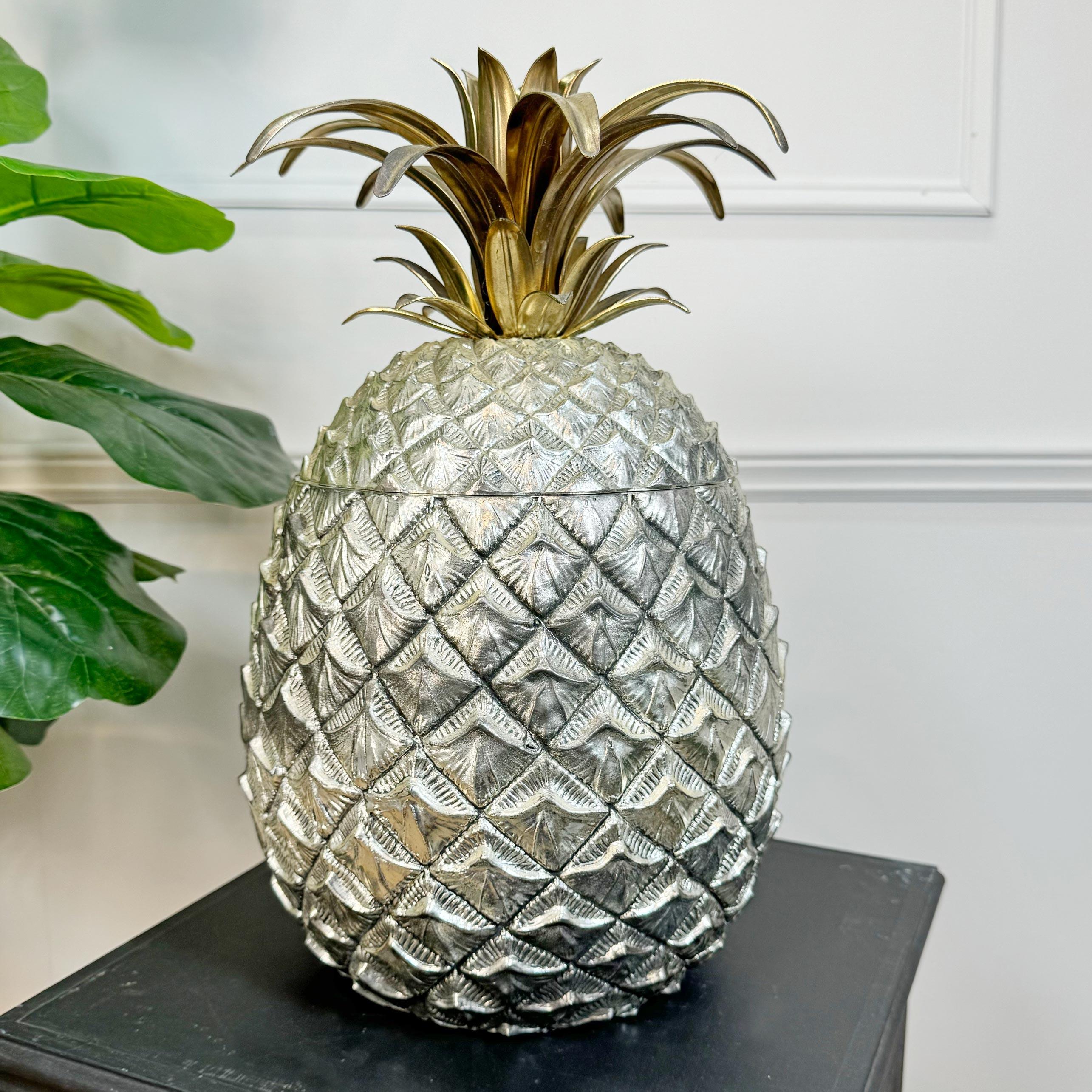 An incredibly rare Mauro Manetti Champagne / Ice Bucket of huge proportions, formed as a silver Pineapple and topped with a gilt frond lid, this exceptional piece has all the original lining and is stamped to the base with the Manetti makers mark.