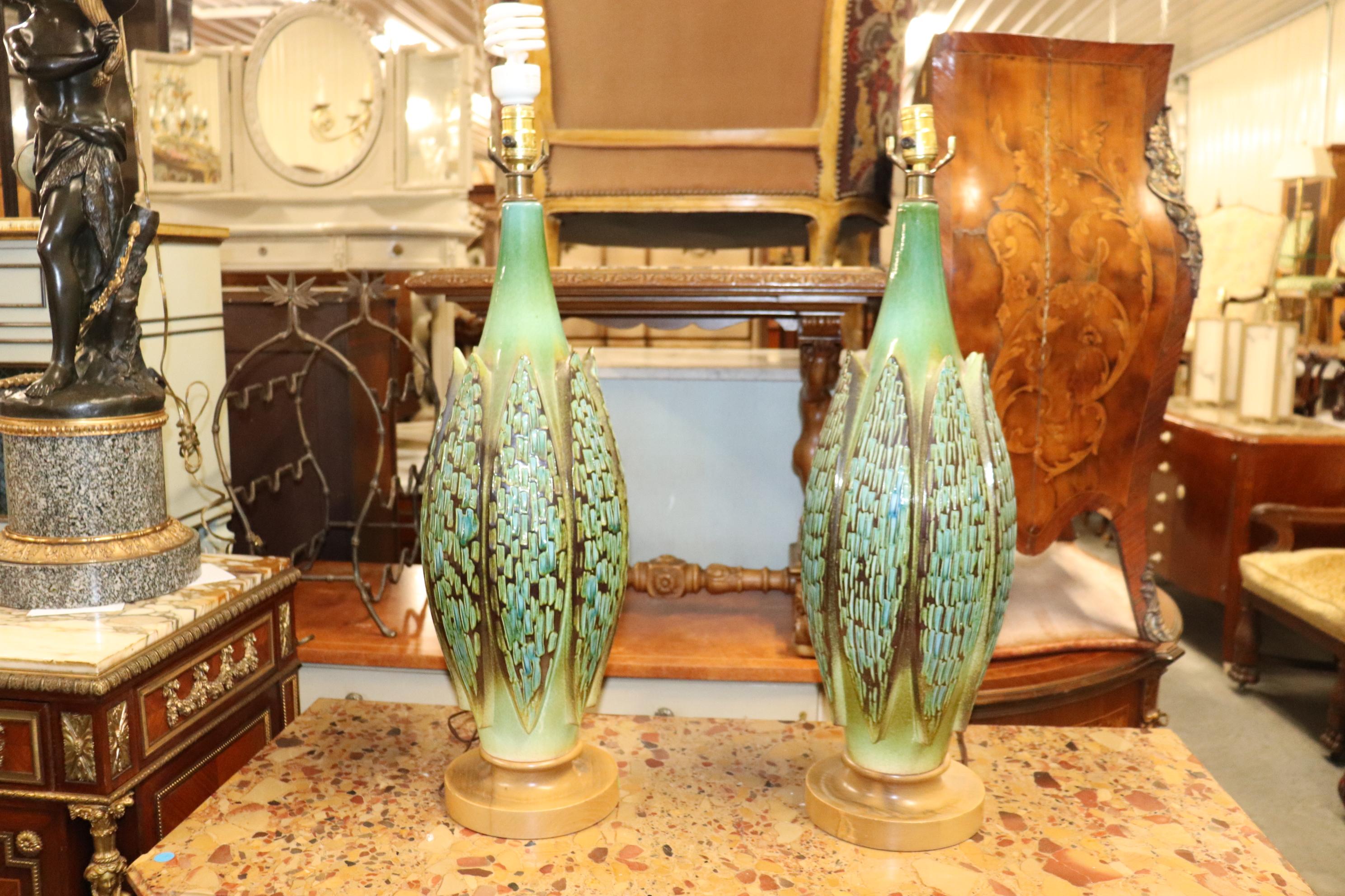 This incredible set of tall linen shade ceramic lamps are in absolutely beautiful condition and measure an imposing 47 inches tall with their shades and 33 tall without them. They are in very good antique vintage condition and date to teh 1950s and