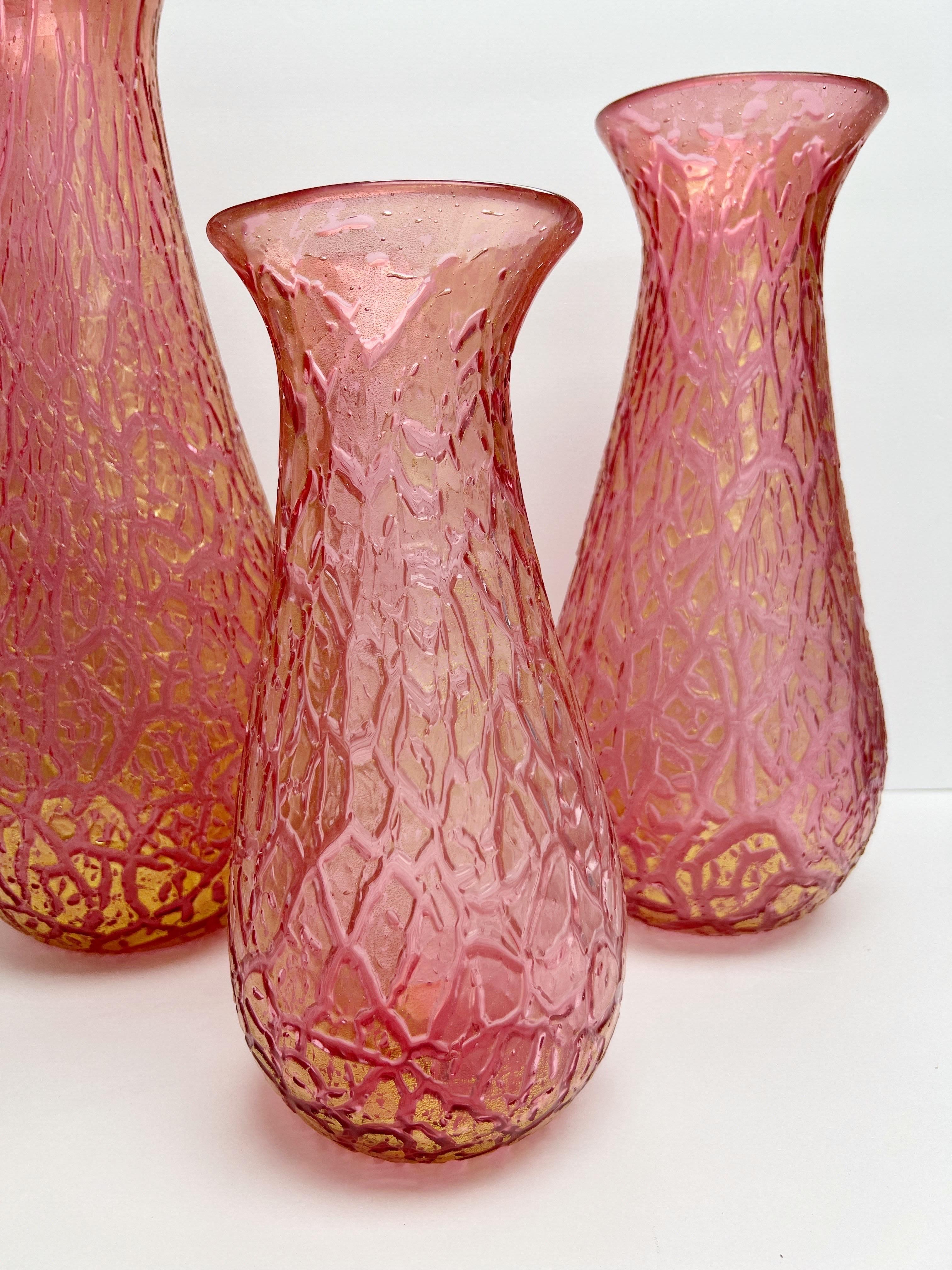 A set of 3 large vessels. the surface has a cracked effect with gold inclusions. 