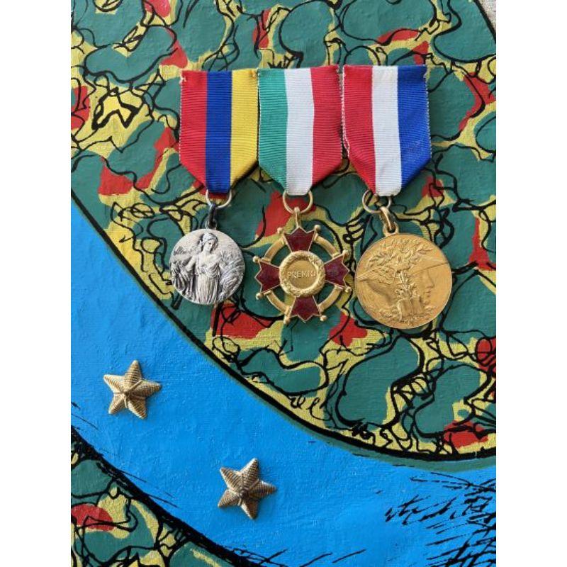 Enrico Baj ( 1924 - 2003 ) - Stratége au double jeu - Mixed media with passamentrie and collage, 1971

Additional information:
Material: A limited edition work from “The Generals” series, edited in 1971
on brocade with originals medals and