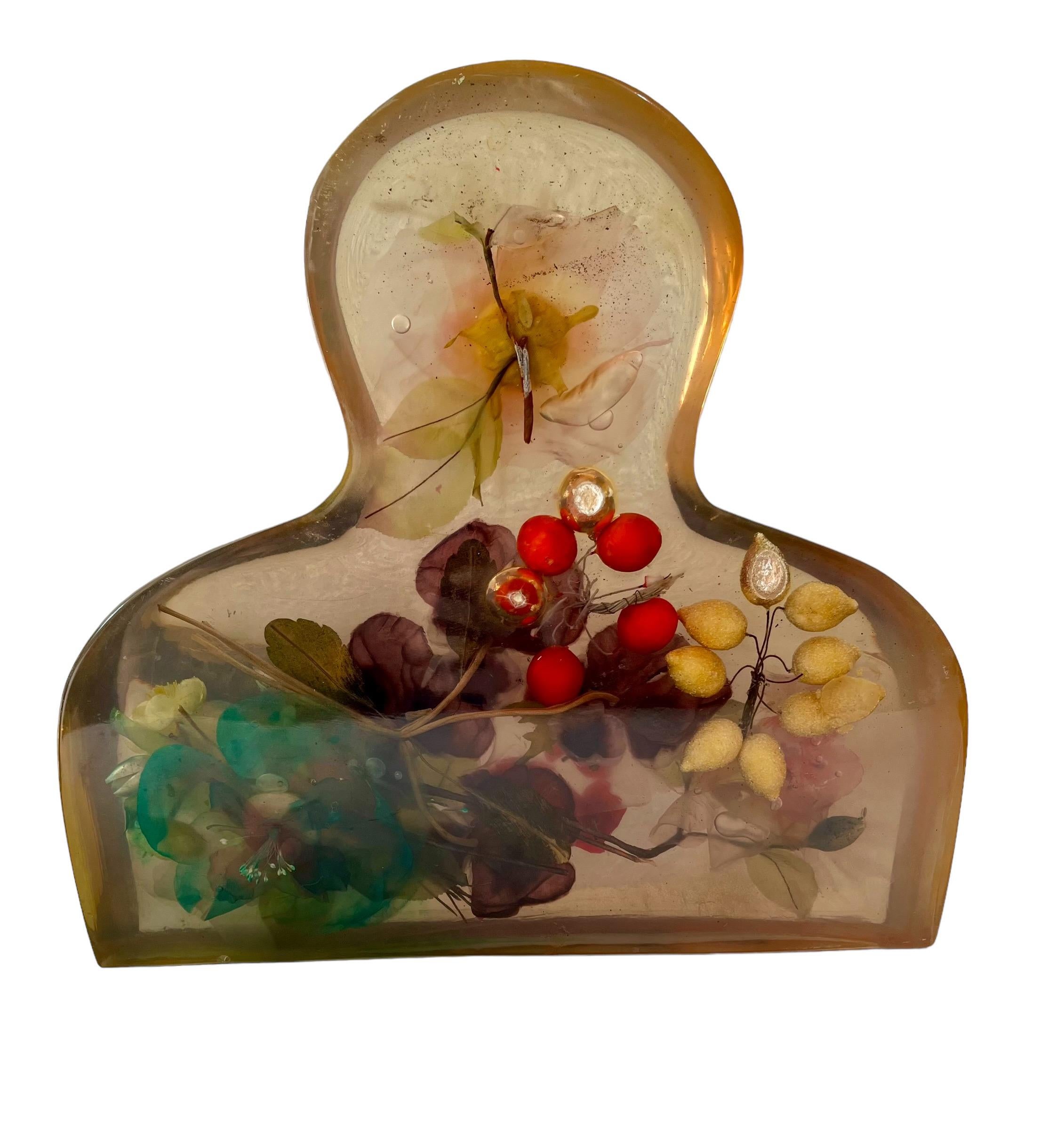 Italian artist Enrico Baj (1924-2003). 
Perspex (acrylic resin) Inclusion Sculpture with flowers and fruit
13.5 X 14 X 4 inches
Hand signed and marked AP
this is not dated.

Baj was born in Milan into a wealthy family, but left Italy in 1944 having