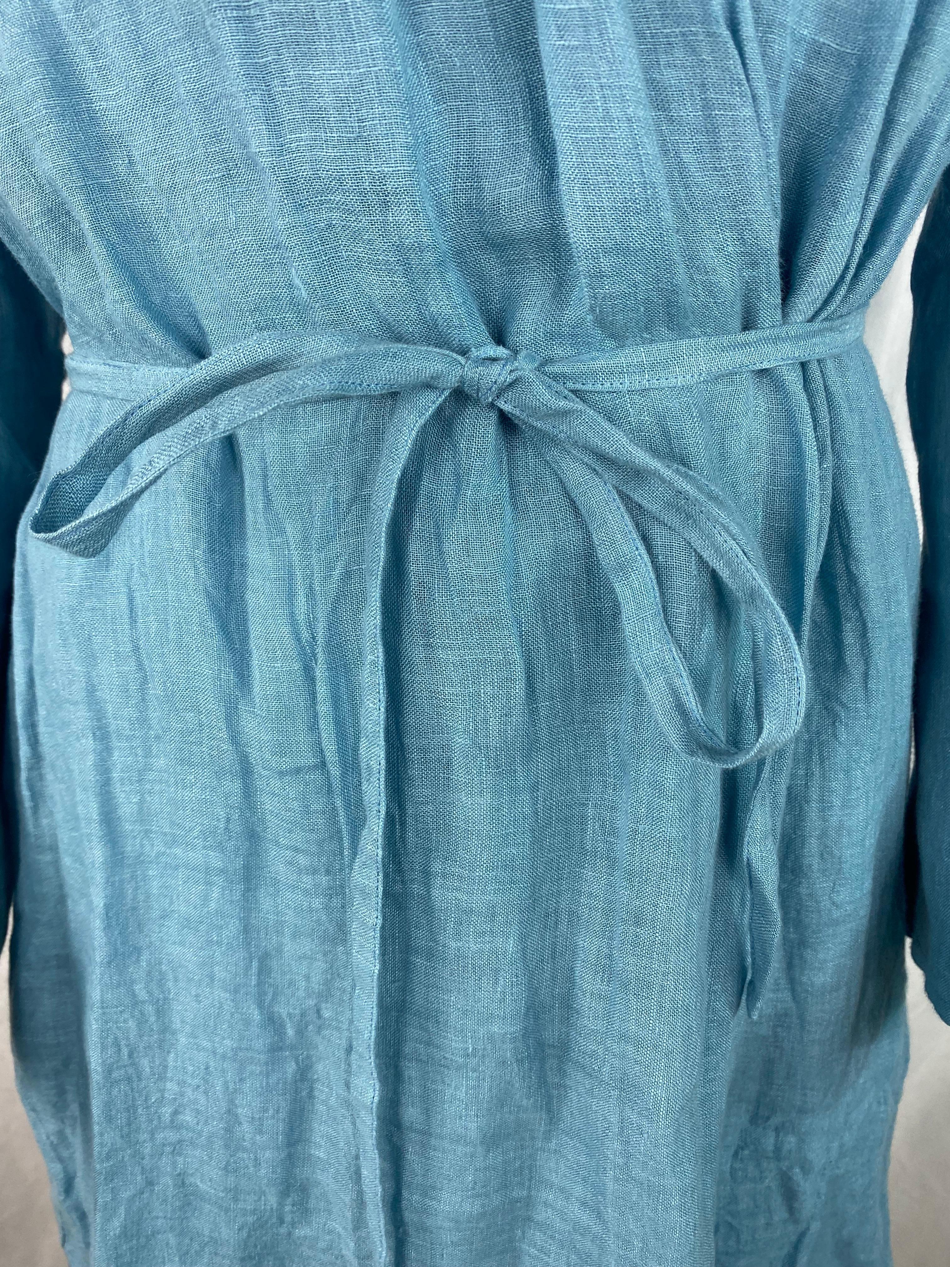 Product details:

The robe is made out of 100% linen, featuring baby blue color, mid length and tie around the waist closure.