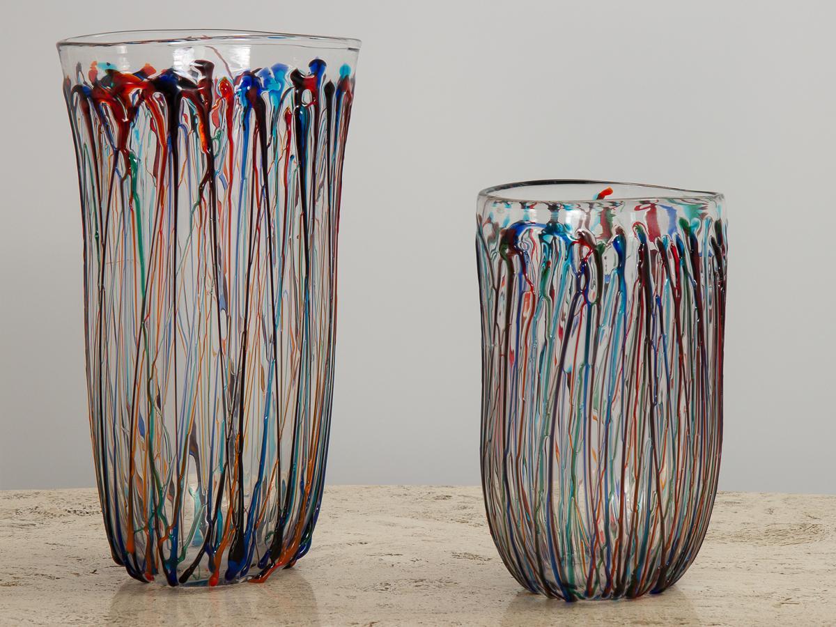 Pair of striking Murano art glass vases, crafted by modern Italian glassmaker Enrico Cammozzo. Oval vases are freely hand blown into an elongated, organic shape, with an abstract applied glass decoration to the exterior. Colorful ribbons of molten