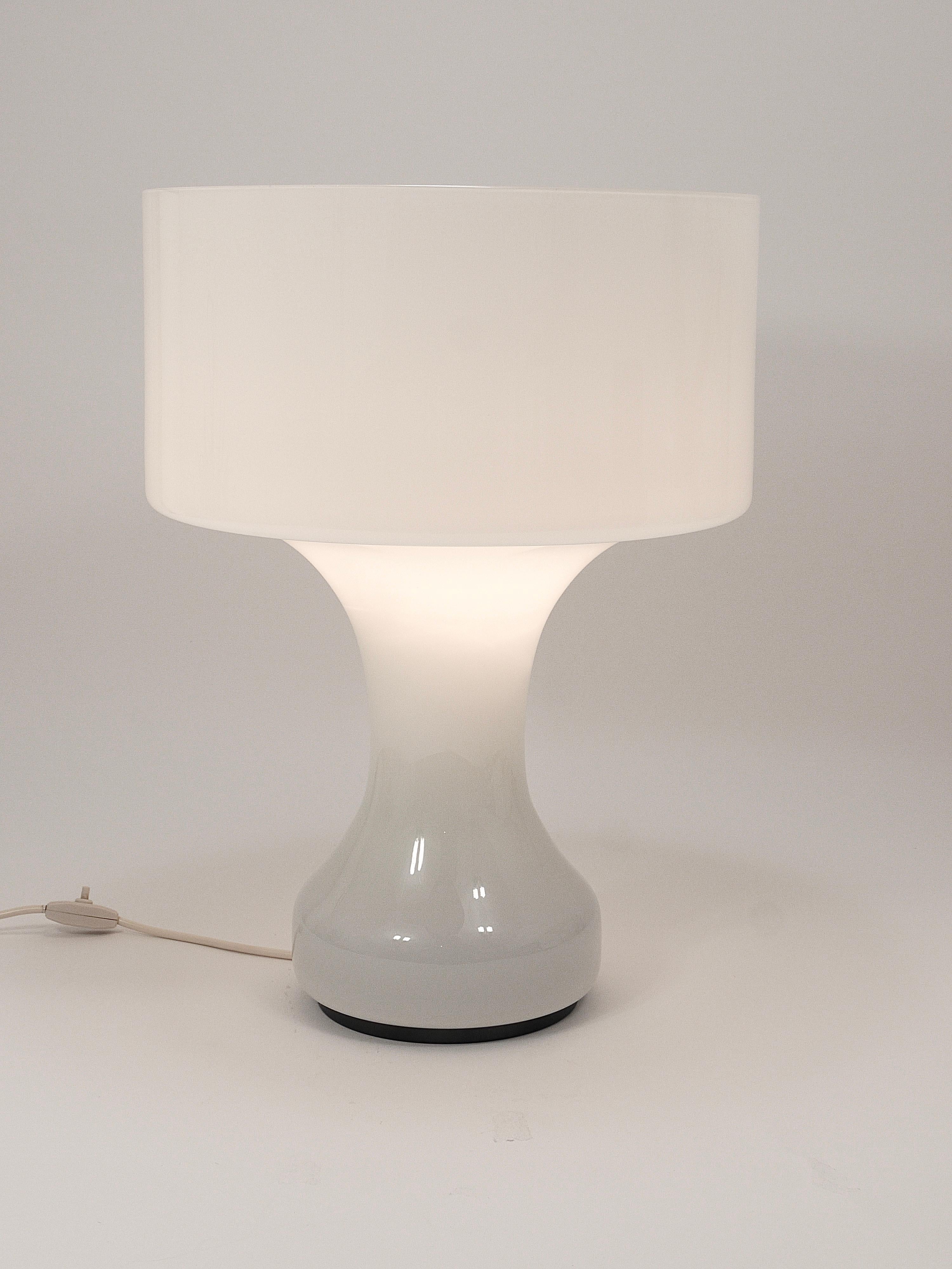 A beautiful and rare large table or floor lamp from the 1960s, designed in 1965 by Italian designer Enrico Capuzzo. Executed by Vistosi Italy, this lamp is a stunning example of Italian craftsmanship. It consists of a large, blow-molded single piece