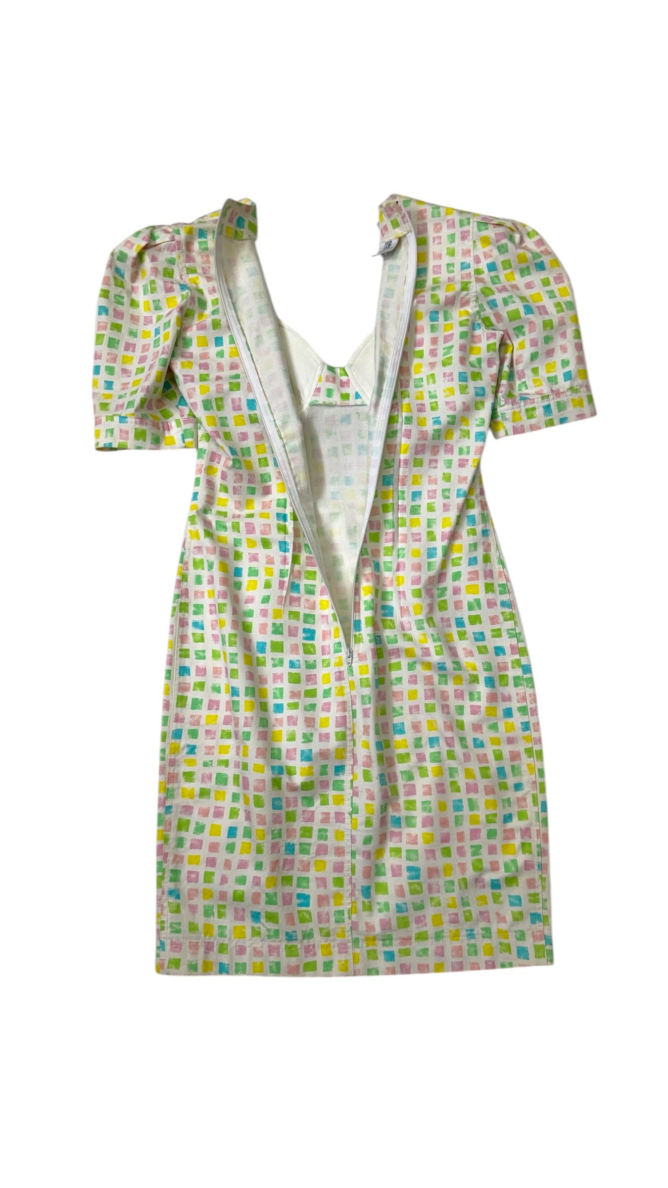 Striking and rare vintage bustier dress from the high-end Enrico Coveri Boutique line, crafted in Italy in the late 1980s. This original piece embodies the playful elegance and bold visual language that defined Enrico Coveri’s golden era.

Made of