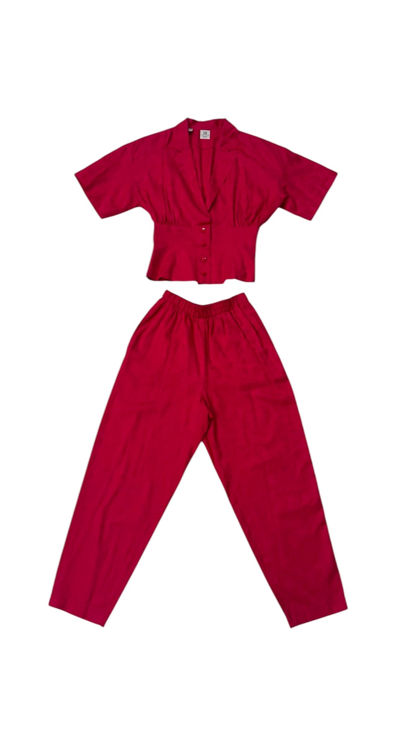 An exceptional vintage two-piece ensemble from the Enrico Coveri Boutique line, crafted in Italy in the late 1980s. This rare set reflects the bold color sensibility and playful sophistication that defined Coveri's high-end creations.

Made in a