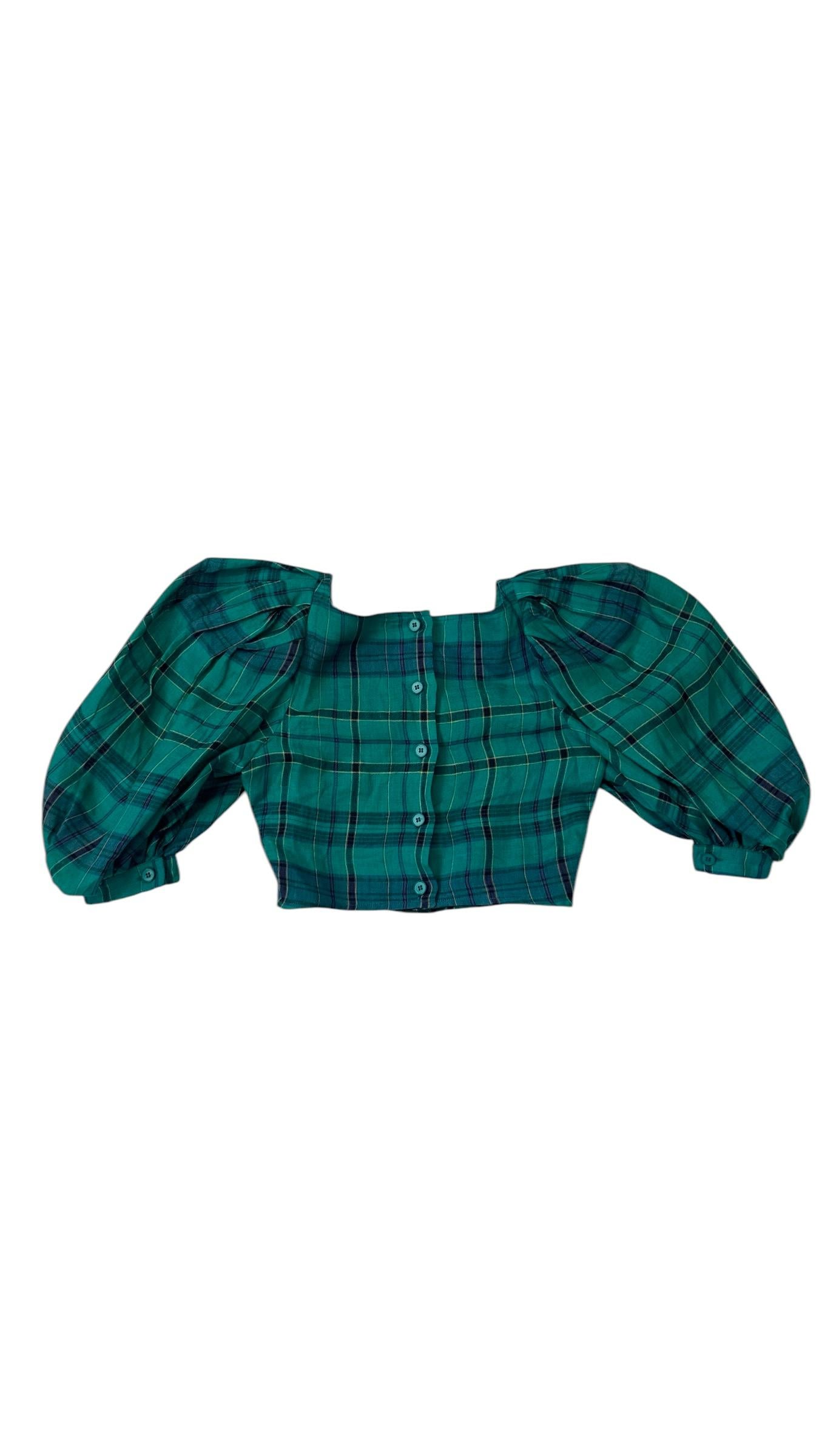 Attributed to SS1988 Collection

A spectacular and museum-worthy tartan ensemble from Enrico Coveri Boutique, directly referencing the designer's iconic advertising campaign from the Spring/Summer 1988 collection. This striking set exemplifies