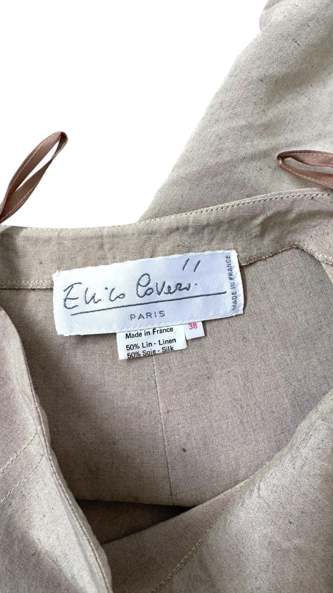 This rare ensemble by Enrico Coveri Paris, composed of a sculptural jacket and matching skirt, showcases the refined and architectural side of the designer's work in the late 1980s to early 1990s. Made in France from an exceptional linen and silk