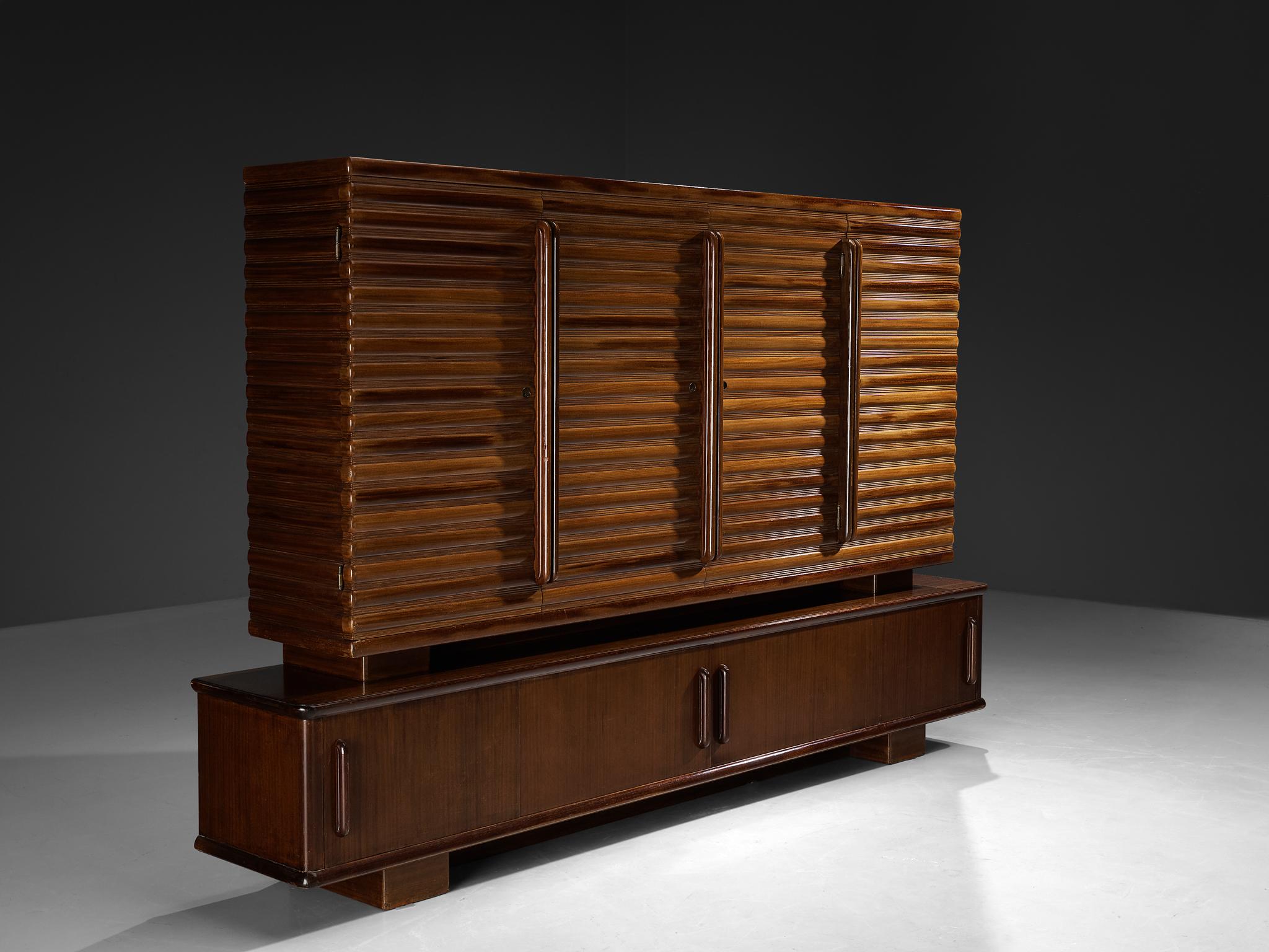 Enrico & Paolo Borghi, sideboard, mahogany, Italy, 1950s

Admirable high sideboard in mahogany with carved doors by Italian duo Enrico & Paolo Borghi, manufactured in the 1950s in Cantu. The storage piece consists of two elements. Firstly, the long