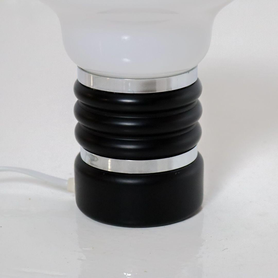 Fairly small Italian 1970s 'Bulb' table lamp, attributed to Enrico Tronconi. The lamp is in very good vintage condition. EU plug can be changed with a simple EU to US plug adapter.