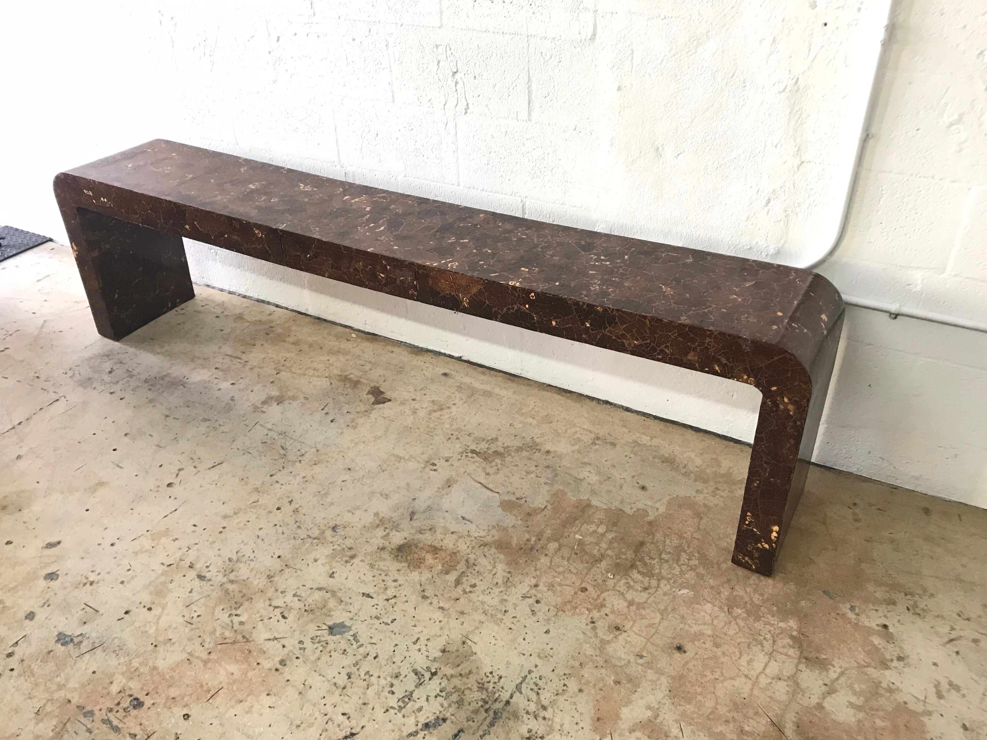 Low waterfall console table rendered in crushed coconut shell designed by Enrique Garcel.