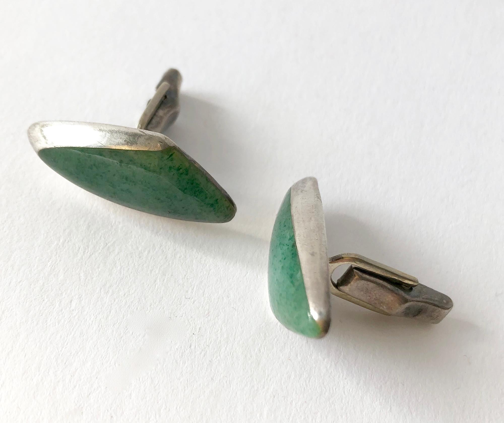 Sterling silver with aventurine triangular stones created by Enrique Ledesma of Taxco, Mexico.  Cufflinks measure 1/2