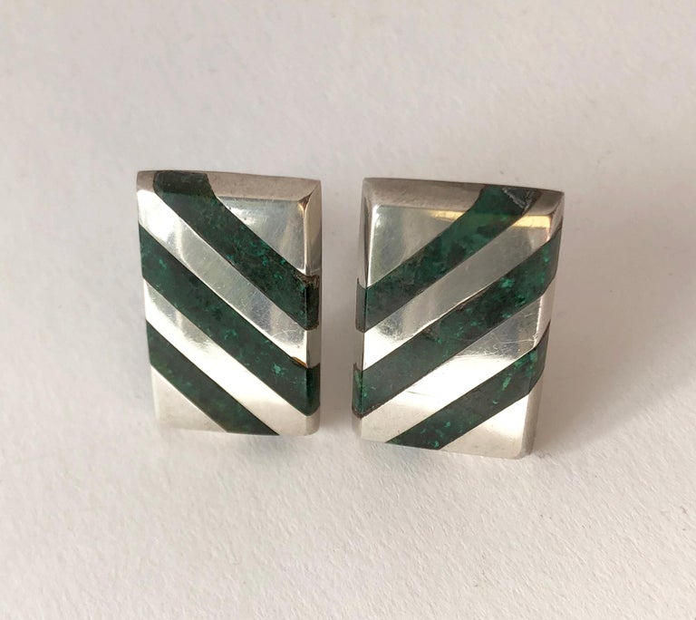 Large scale 1950's sterling silver cufflinks with inlaid malachite design created by Enrique Ledesma of Taxco, Mexico.  Cufflinks measure .75