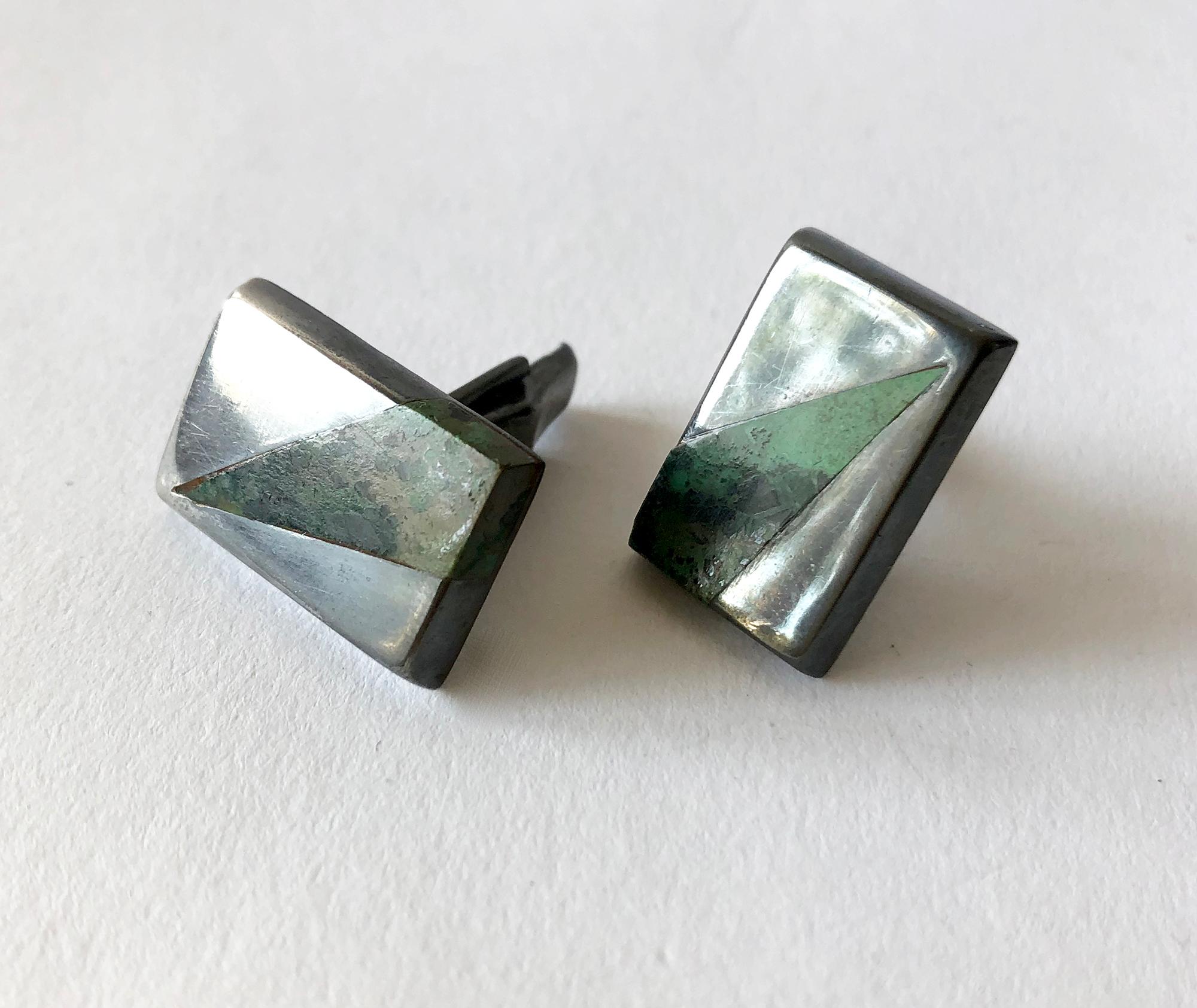 Mexican jade with variegated stone set in darkened sterling silver cufflinks by Enrique Ledesma of Taxco, Mexico.  Cufflinks measure 5/8