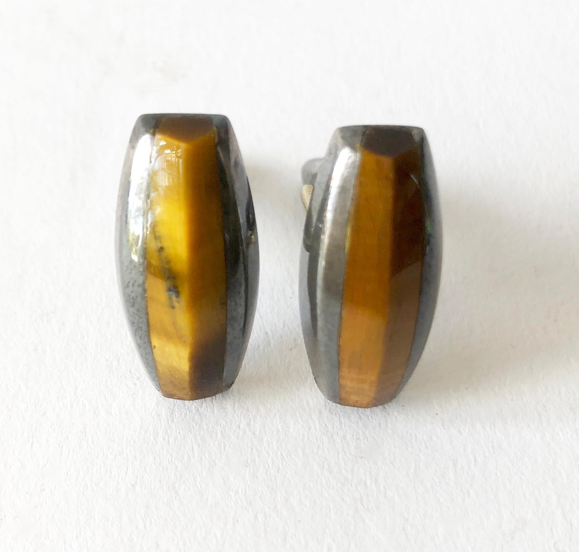 Darkened sterling silver and tiger's eye modernist cufflinks created by Enrique Ledesma of Taxco, Mexico. Cufflinks measure 1