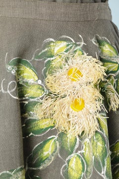 Ensemble in grey linen with Raphia flowers and hand painting leeve Nelly de Grab