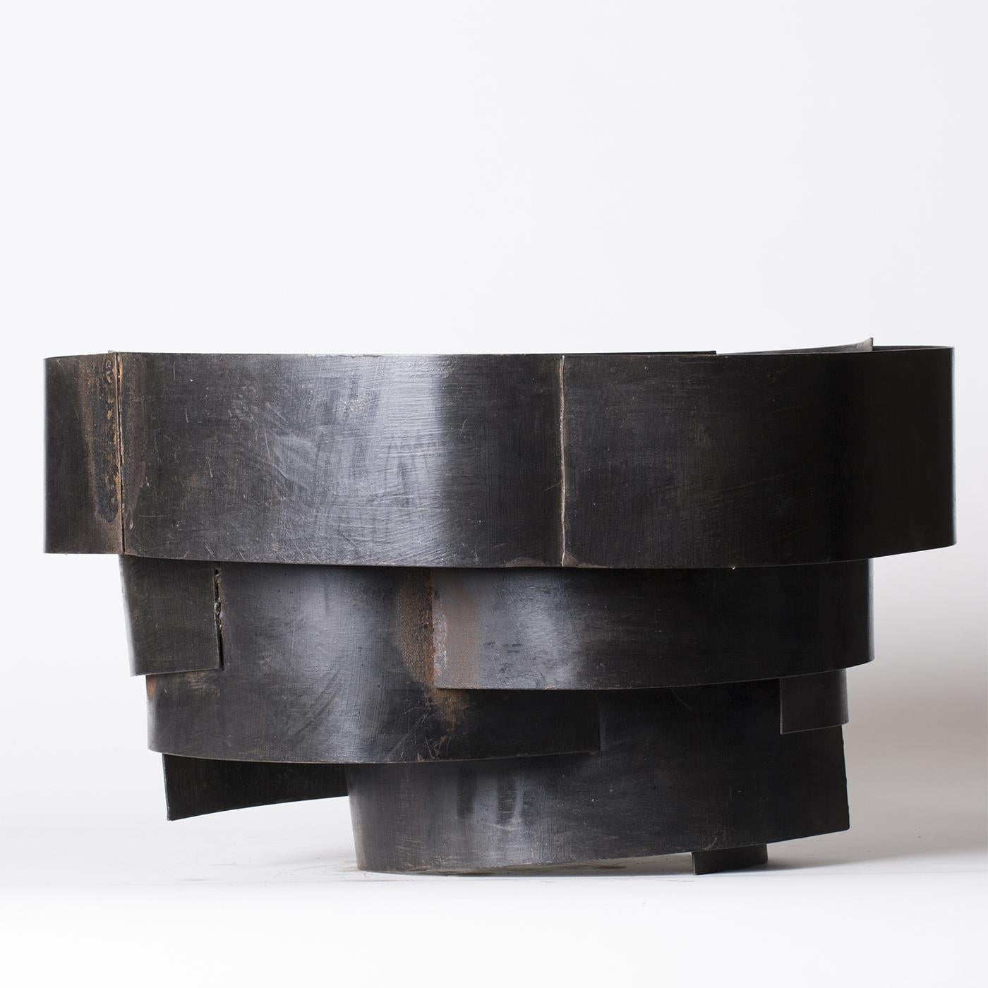 This minimalistic sculpture in concentric sheet iron by Sciortino is painted in black for a compellingly disjointed look. Measurements and finishes may vary slightly due to the artistic nature of Sciortino's pieces.
  