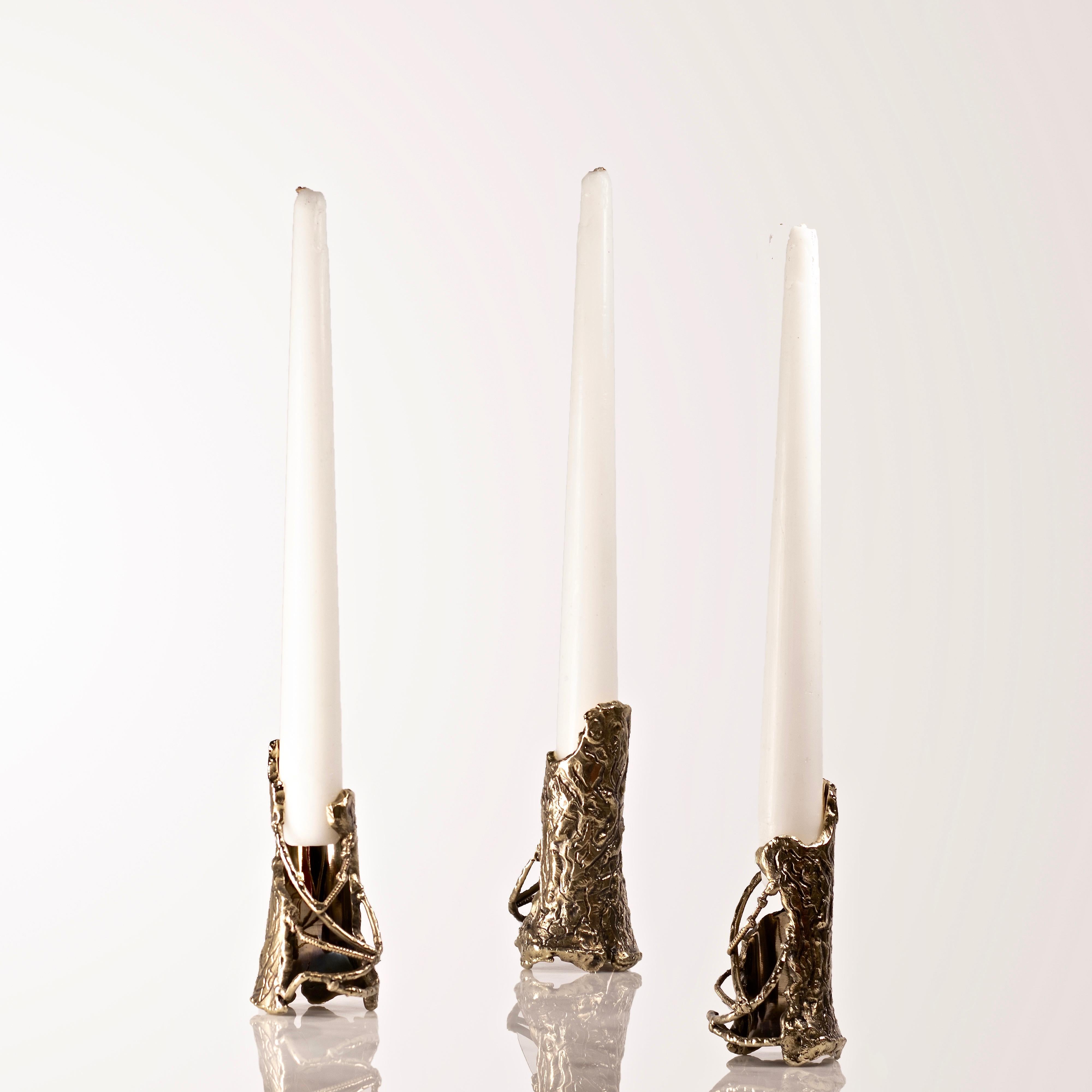 Ensemble of brass hand-sculpted candleholders by Samuel Costantini.
The three candleholders were entirely handmade by the artist.
Edition of 21+ 3 ap.
Measures: diameter 50mm, height 100 mm.
Diameter 1.9681inches, height 3.937.

Pieces of bark
